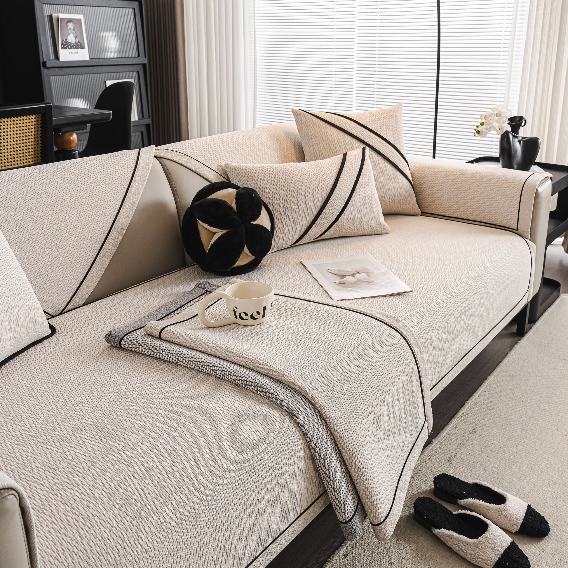 Herringbone Couch Protector for Pets, Non-Slip Washable Sectional Couch Covers on a stylish cream sofa with black accents.