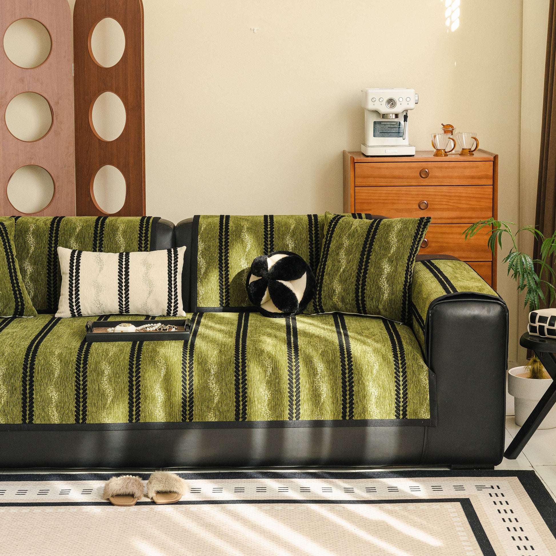 Living room with Non-Slip Sofa Cover with Thick Chenille Texture Woven Stripe Couch Protector Throw on a black sofa