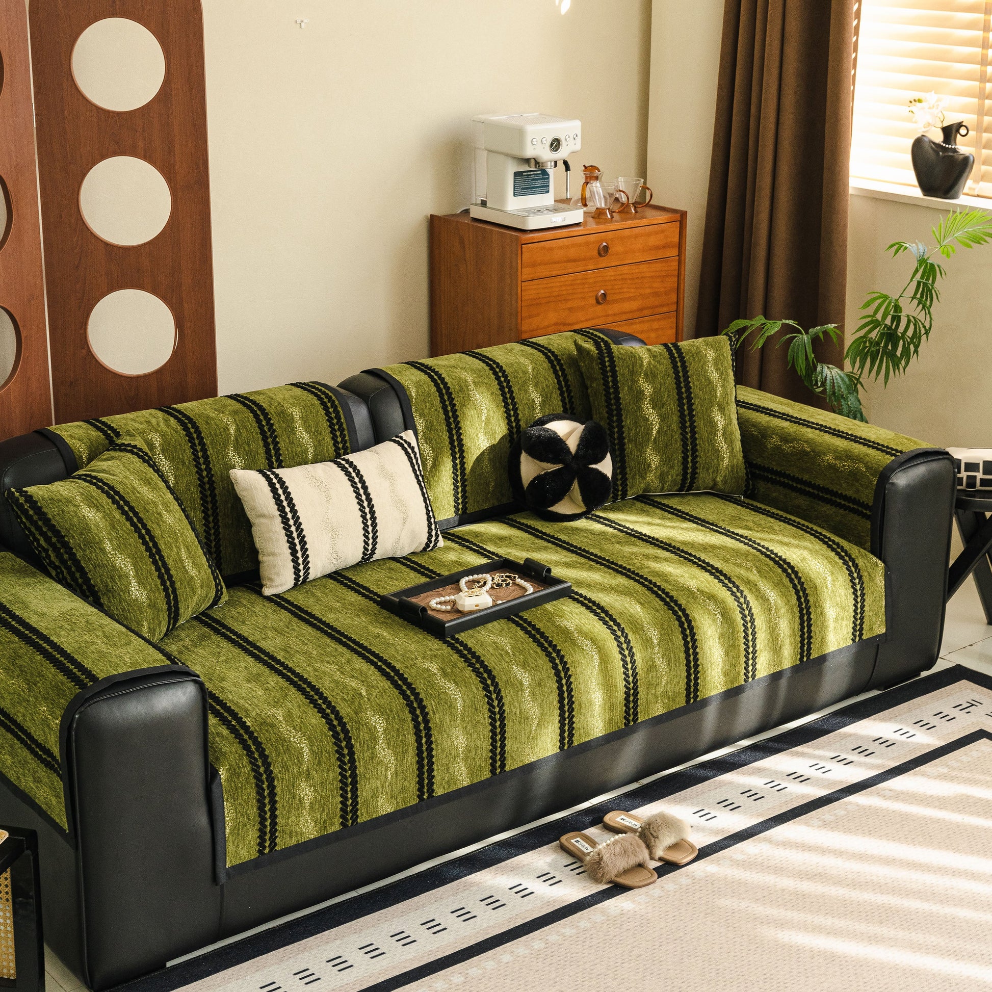 Non-Slip Sofa Cover with Thick Chenille Texture Woven Stripe Couch Protector Throw on a green sofa in a cozy living room.