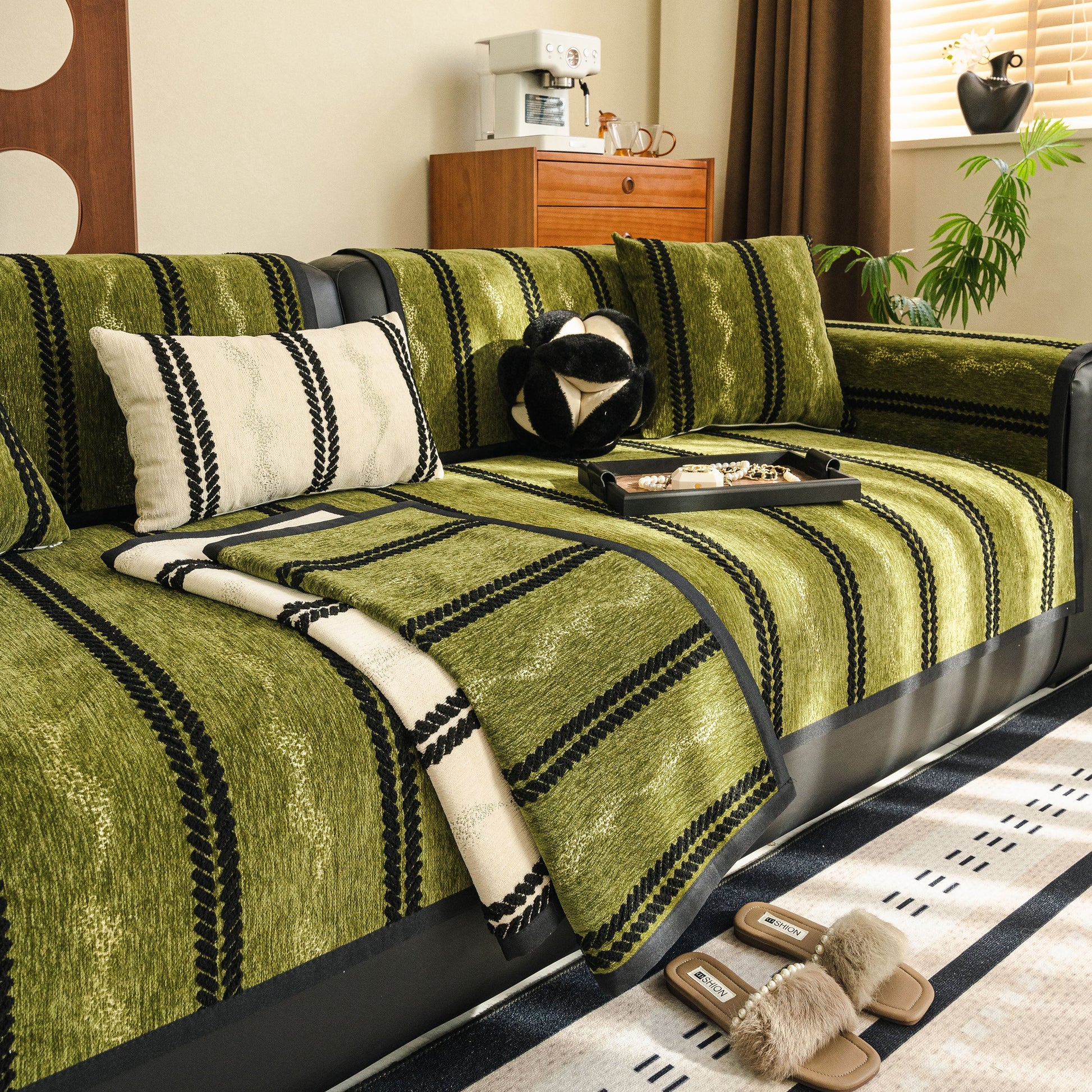 Non-Slip Sofa Cover with Thick Chenille Texture Woven Stripe Couch Protector Throw on a green three-seater sofa