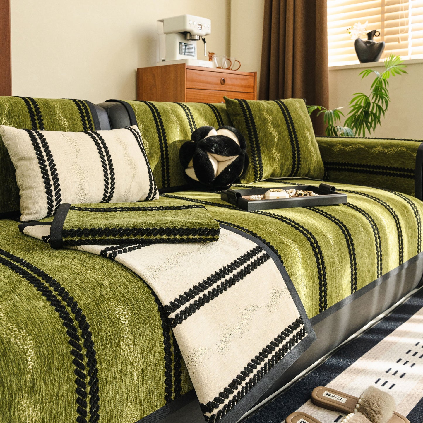 Living room scene with Non-Slip Sofa Cover with Thick Chenille Texture Woven Stripe Couch Protector Throw in green and beige.