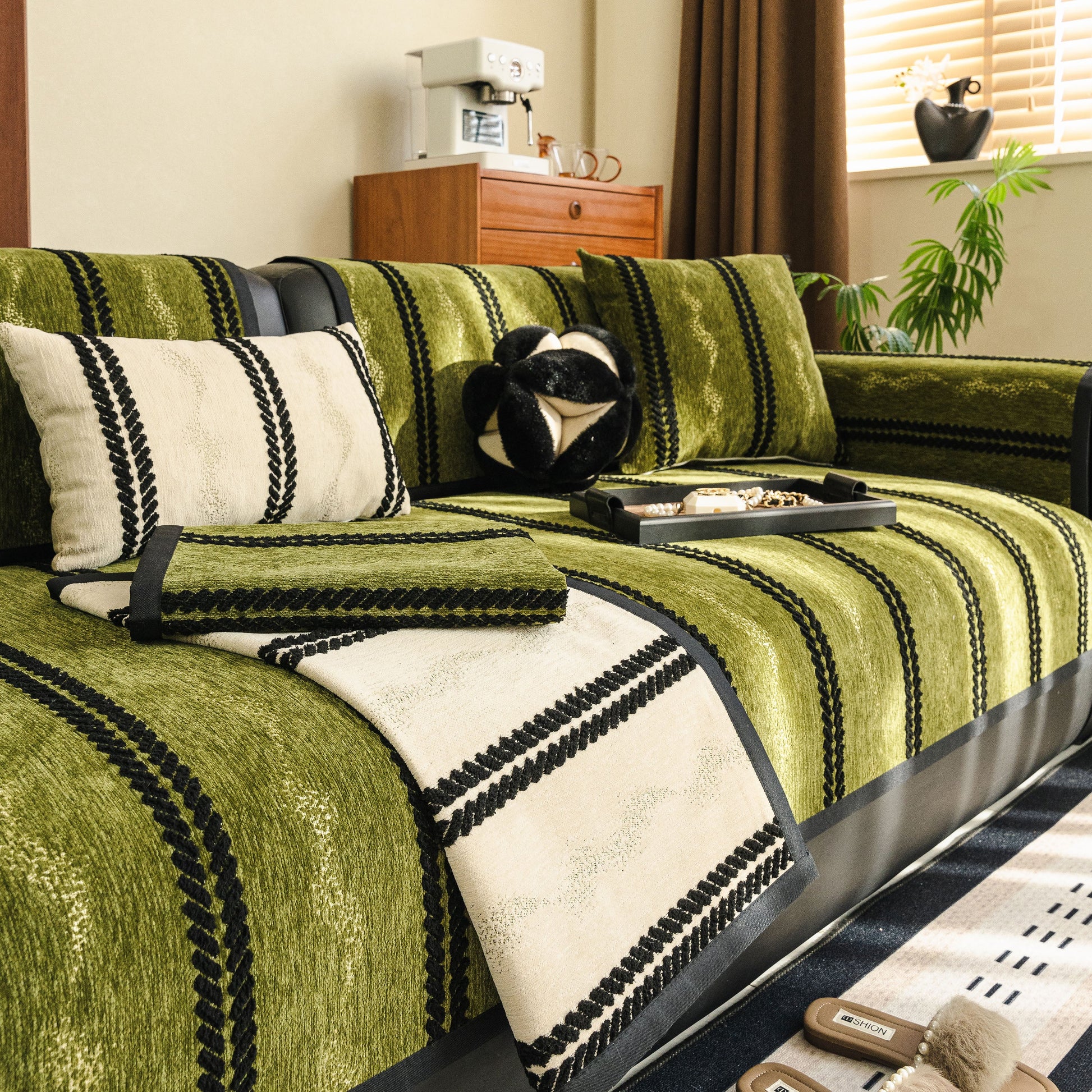Living room scene with Non-Slip Sofa Cover with Thick Chenille Texture Woven Stripe Couch Protector Throw in green and beige.