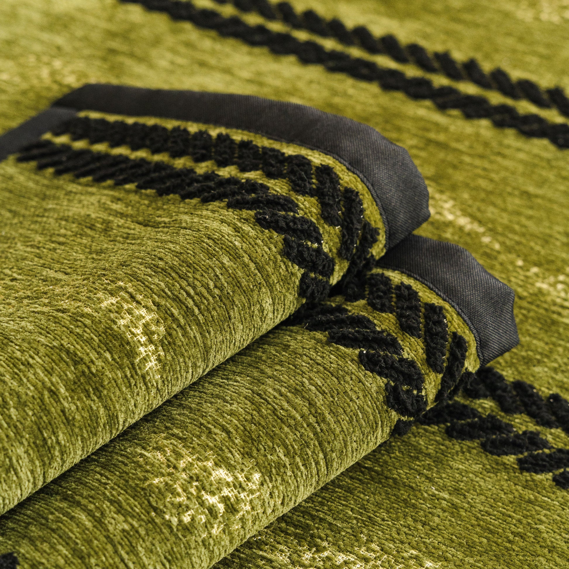 Non-Slip Sofa Cover with Thick Chenille Texture Woven Stripe Couch Protector Throw in green texture with black 3D trim.