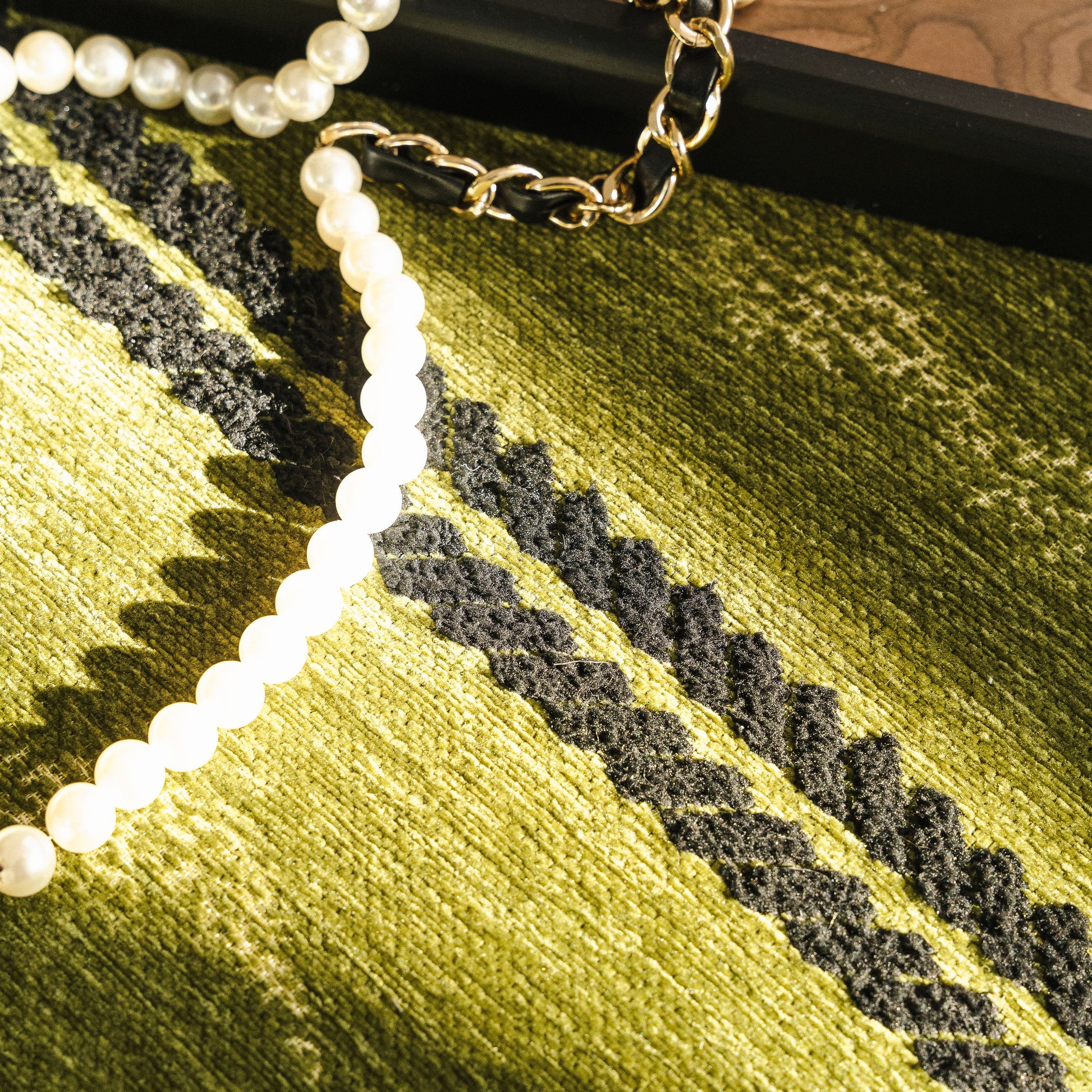 Non-Slip Sofa Cover with Thick Chenille Texture Woven Stripe Couch Protector Throw on green textured fabric close-up