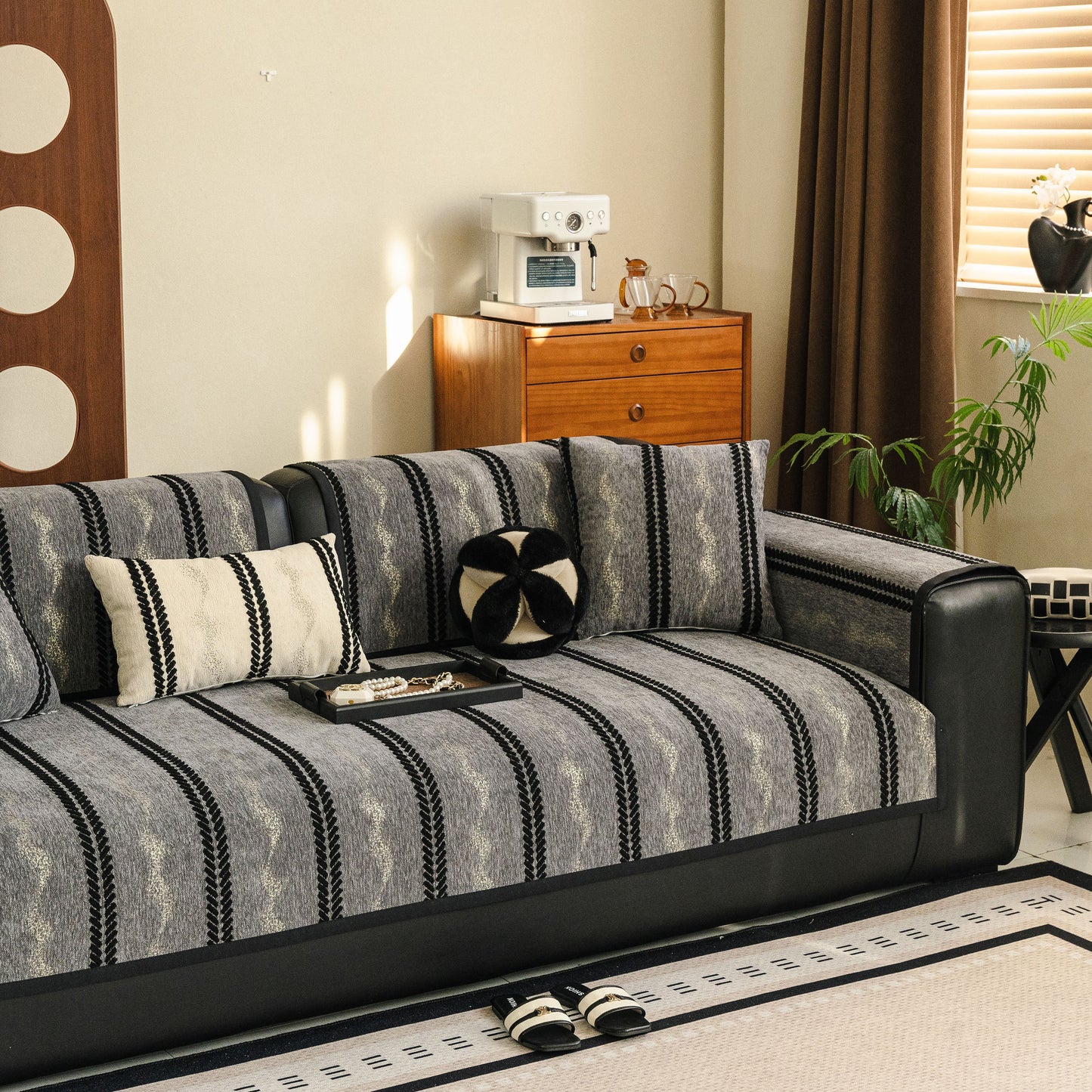 Room featuring a Non-Slip Sofa Cover with Thick Chenille Texture Woven Stripe Couch Protector Throw, enhancing sofa's modern look.