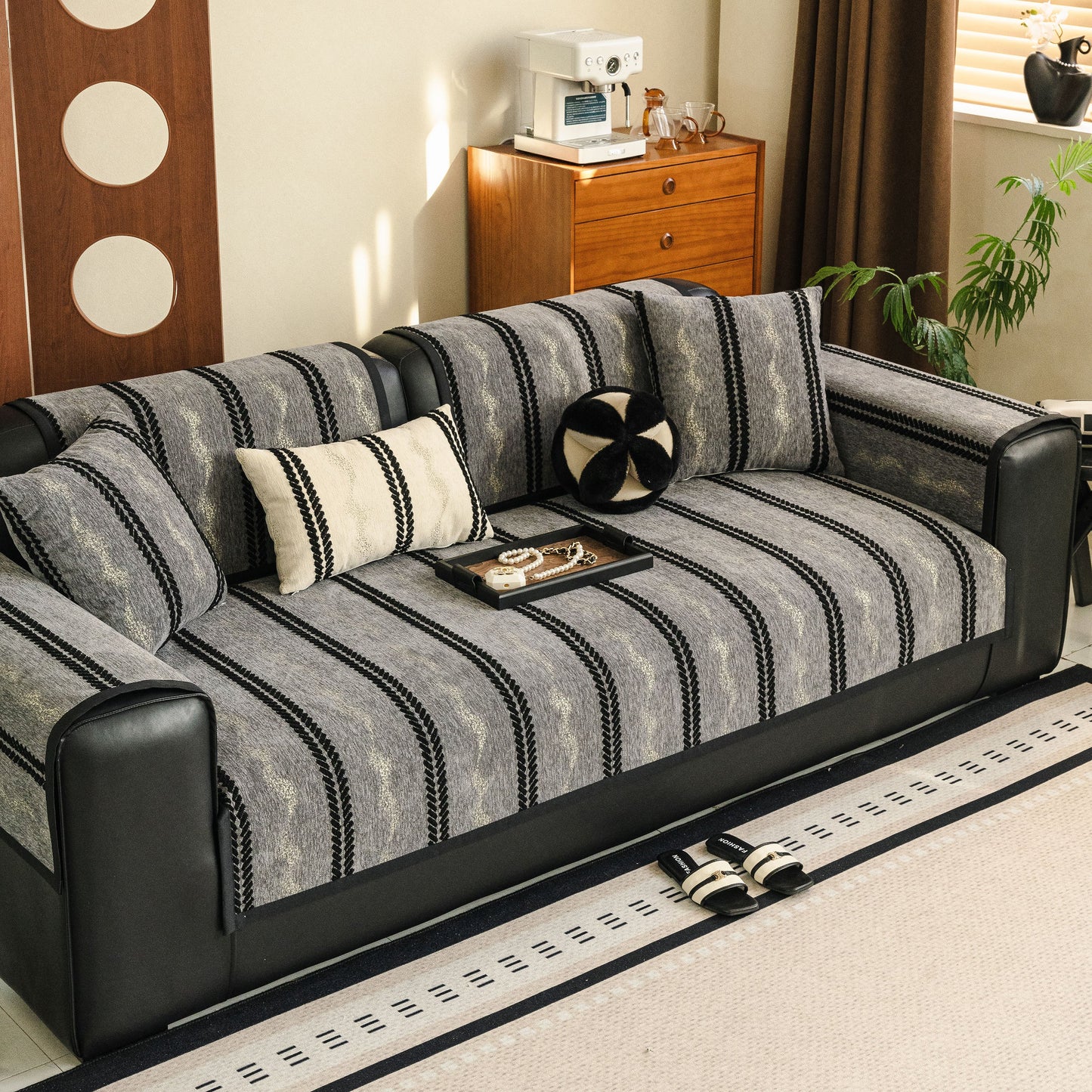 Non-Slip Sofa Cover with Thick Chenille Texture Woven Stripe Couch Protector Throw on a black leather sofa
