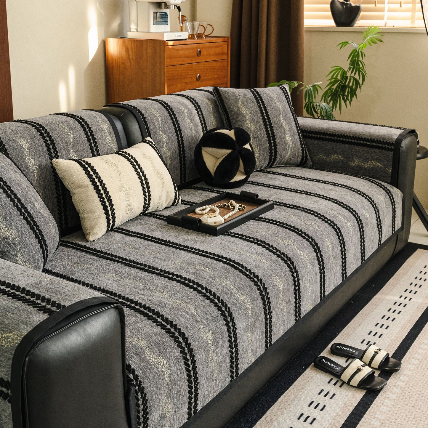 Non-Slip Sofa Cover with Thick Chenille Texture Woven Stripe Couch Protector Throw on modern sofa in living room.