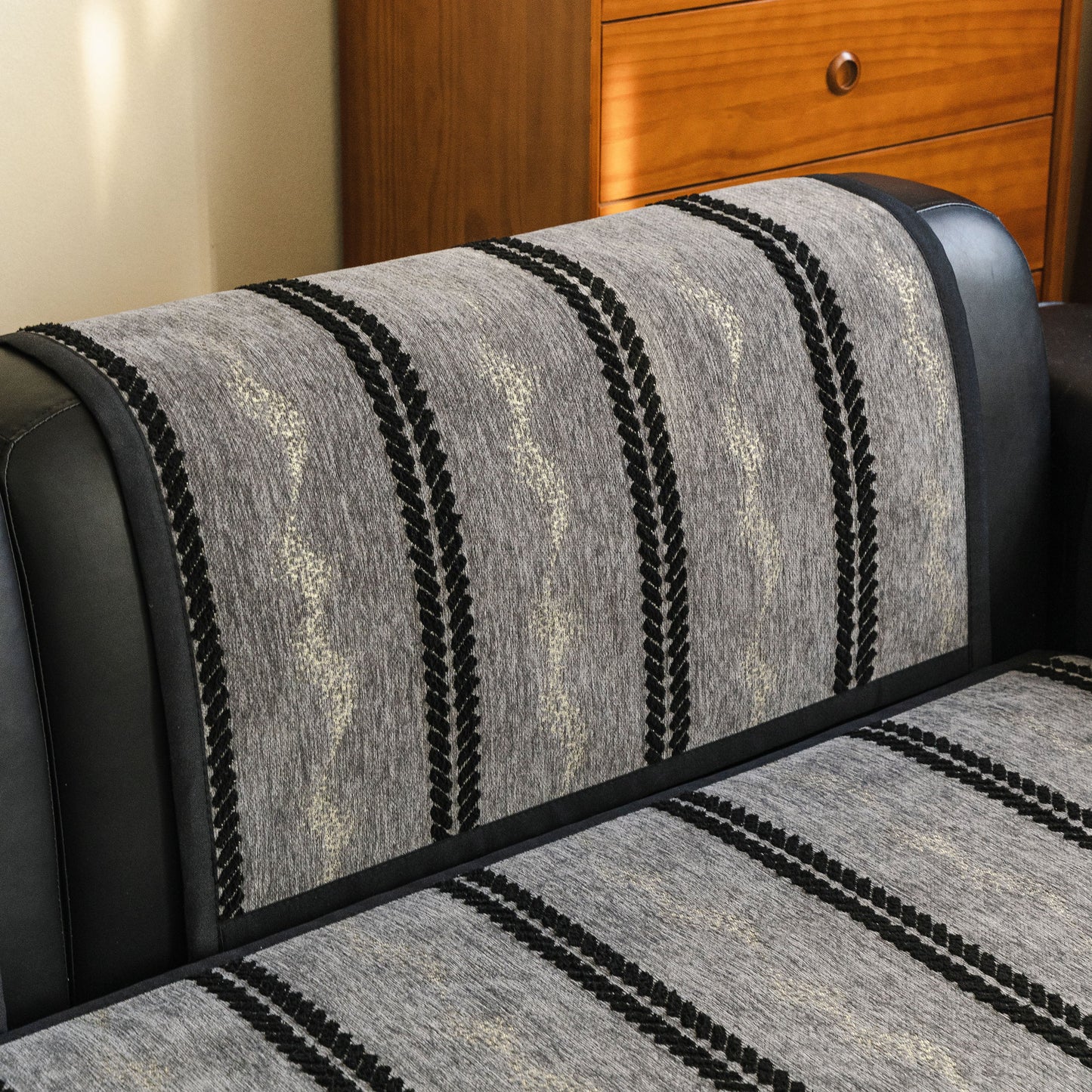 Non-Slip Sofa Cover with Thick Chenille Texture Woven Stripe Couch Protector Throw on a sofa, showcasing textured design and 3D woven trim.