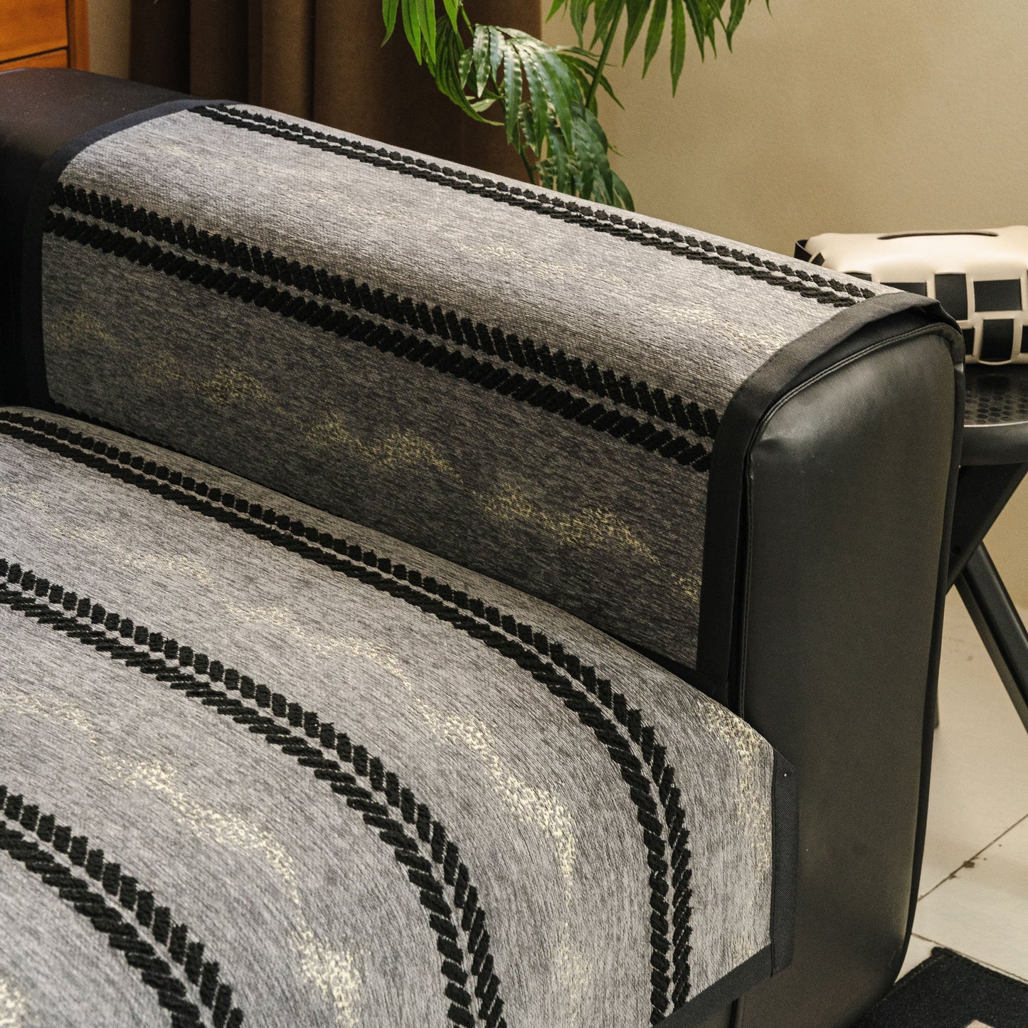Non-Slip Sofa Cover with Thick Chenille Texture Woven Stripe Couch Protector Throw on sofa, showing vertical stripes and anti-slip backing.