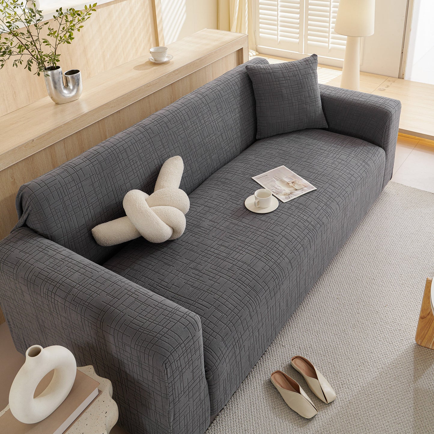 Embossed Lines Couch Covers Stretchable Non-Slip & Washable Sofa Slipcovers on gray couch in modern living room setting