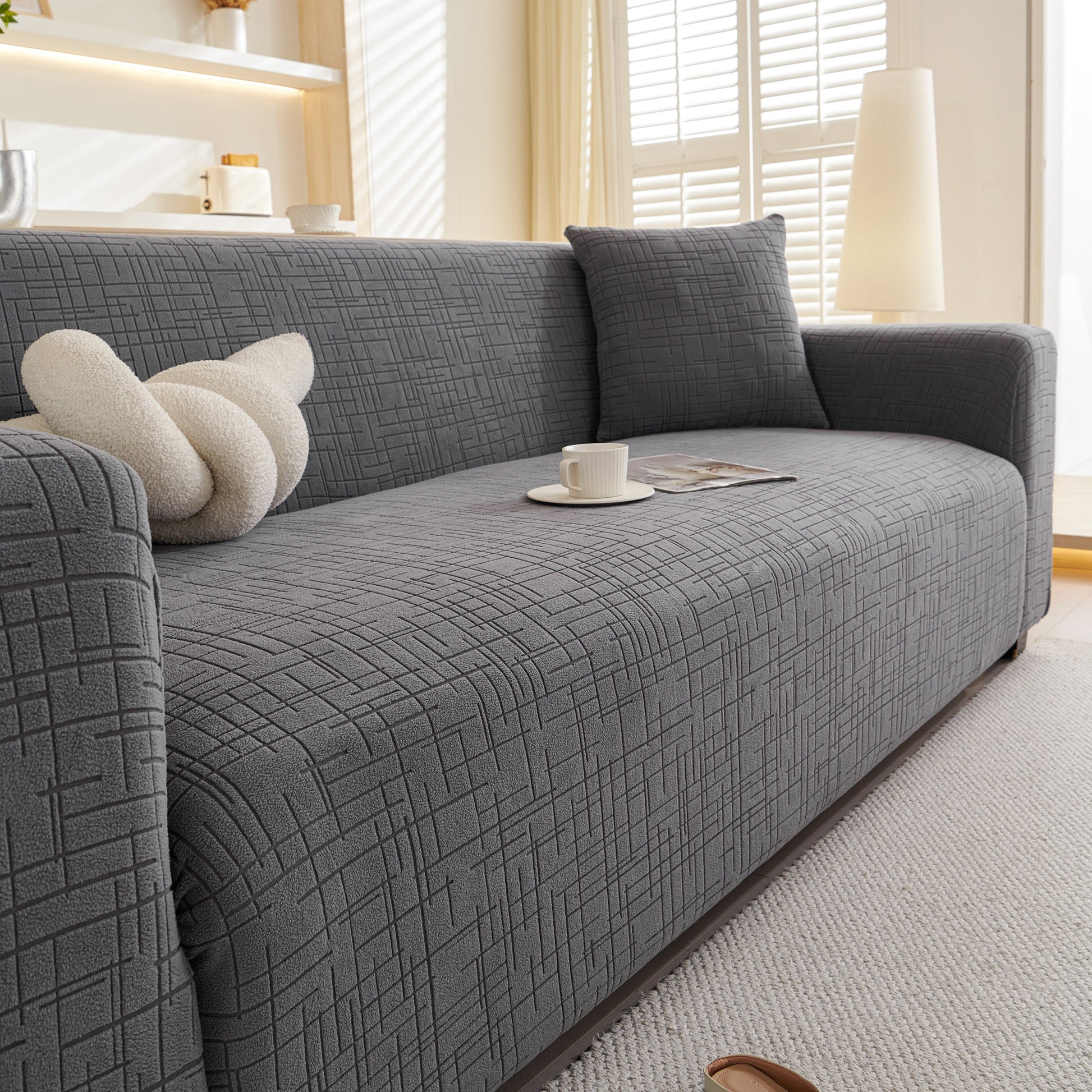 Embossed Lines Couch Covers Stretchable Non-Slip & Washable Sofa Slipcovers on grey couch in living room setting