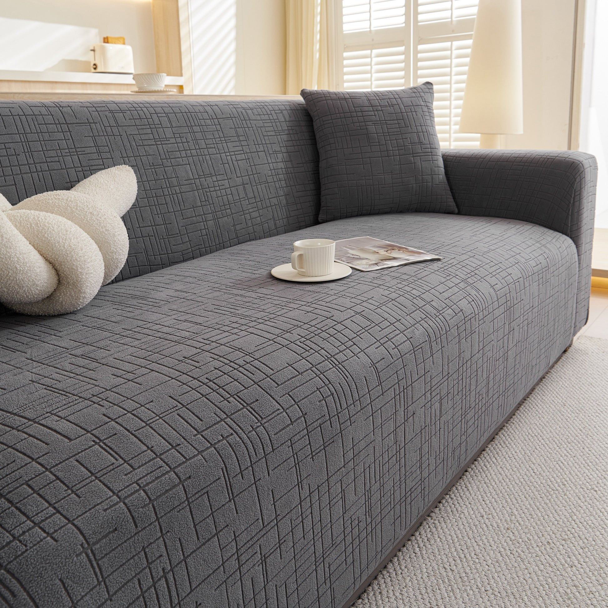 Embossed Lines Couch Covers Stretchable Non-Slip & Washable Sofa Slipcovers on modern grey sofa in cozy living room setting