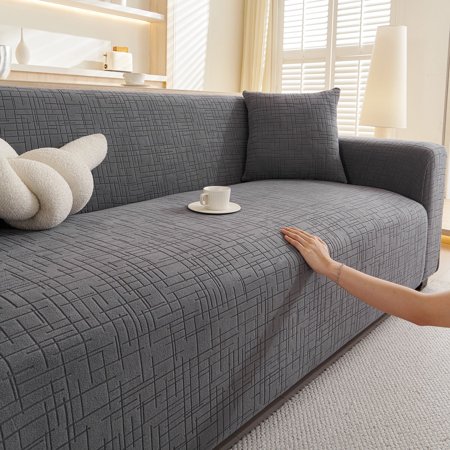 Embossed Lines Couch Covers Stretchable Non-Slip & Washable Sofa Slipcovers on gray sofa in modern living room
