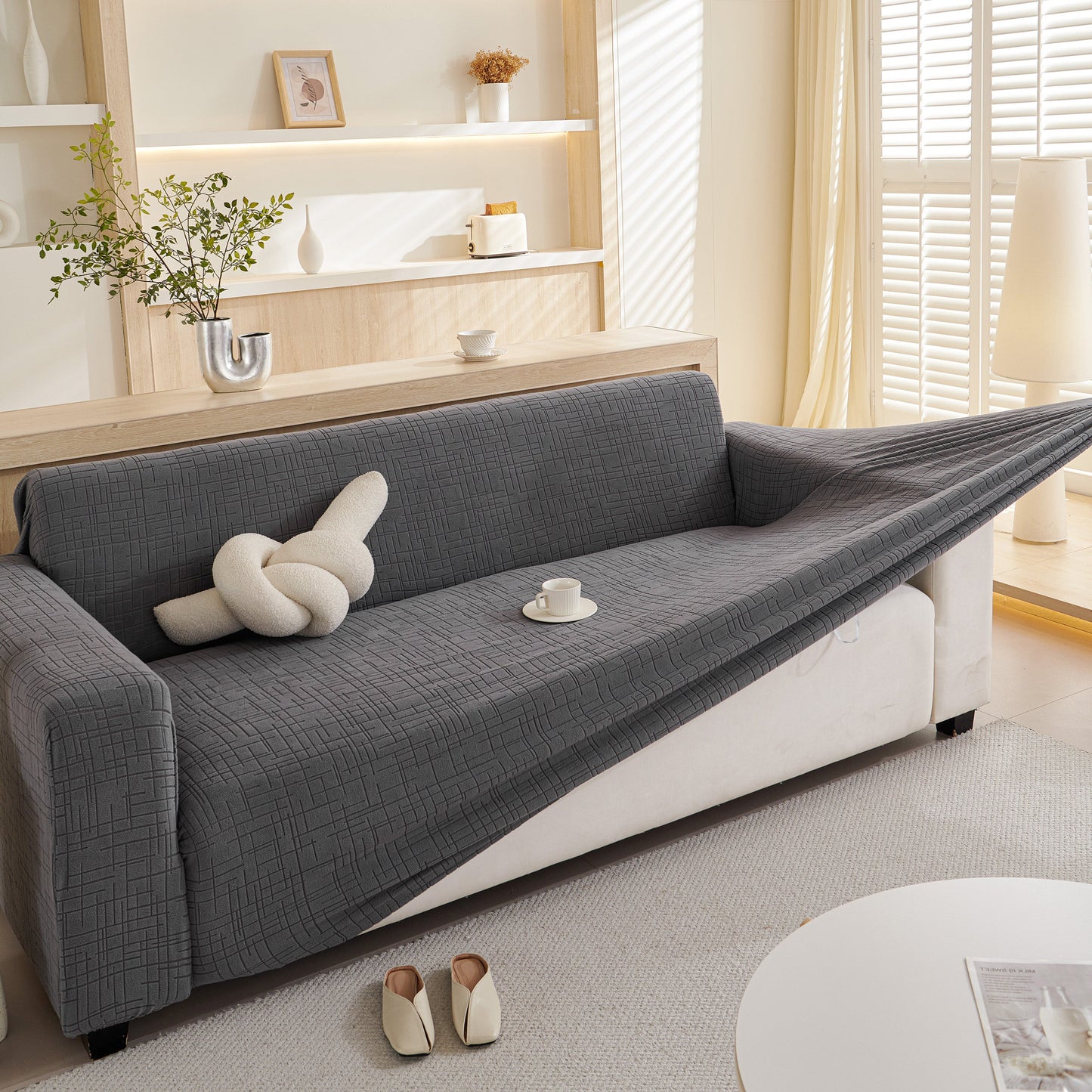 Living room with Embossed Lines Couch Covers Stretchable Non-Slip & Washable Sofa Slipcovers in a modern interior setting.