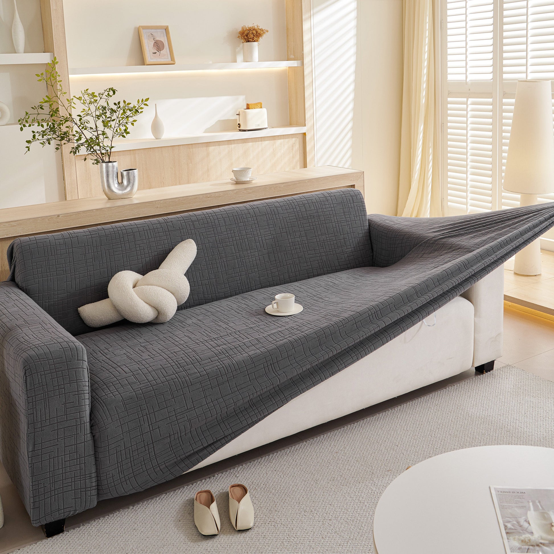 Living room with Embossed Lines Couch Covers Stretchable Non-Slip & Washable Sofa Slipcovers in a modern interior setting.