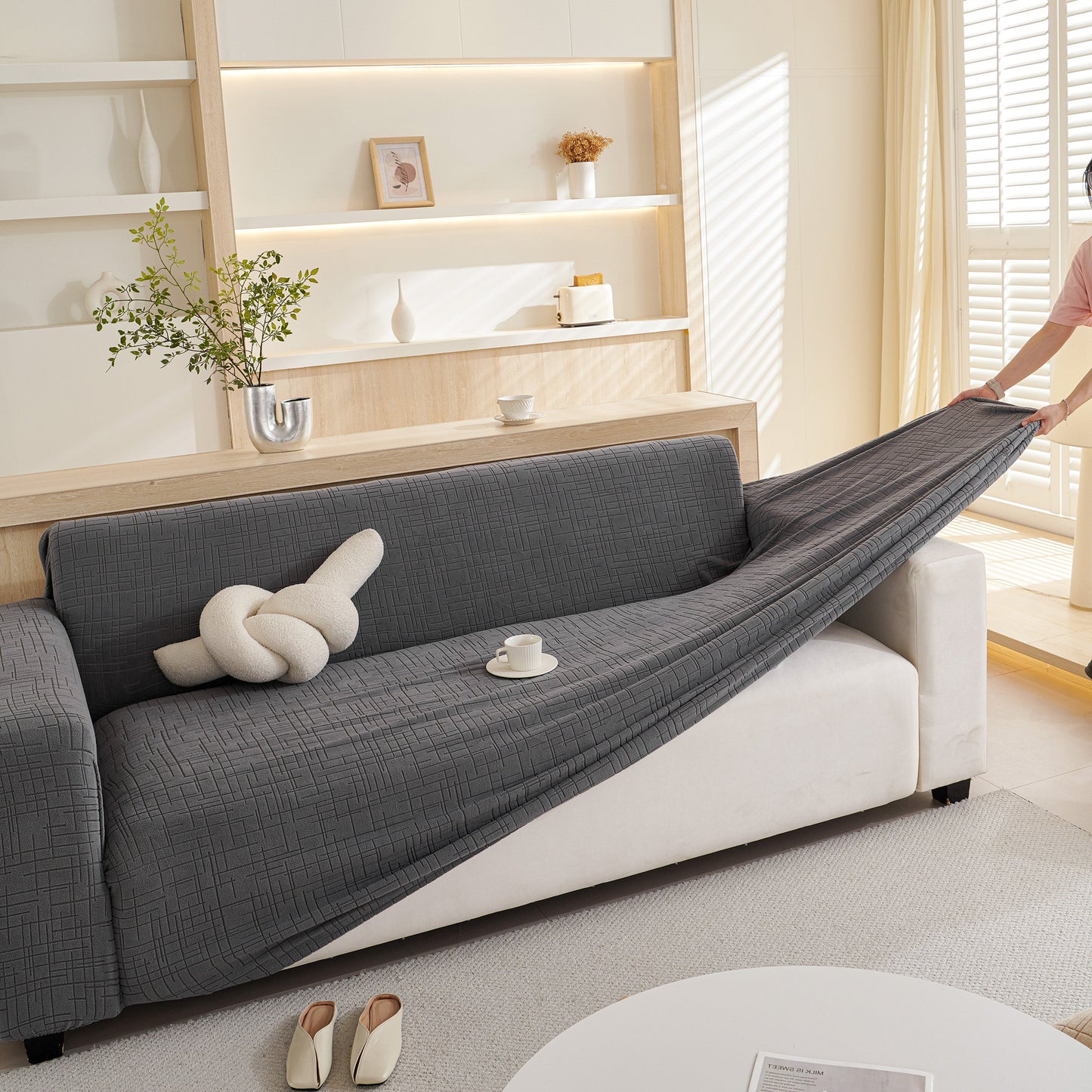 "Embossed Lines Couch Covers Stretchable Non-Slip & Washable Sofa Slipcovers in gray on a white couch"