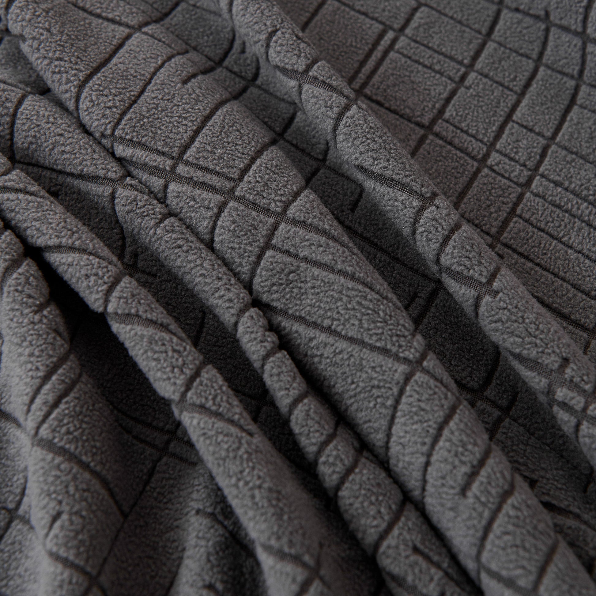 Close-up of Embossed Lines Couch Covers Stretchable Non-Slip & Washable Sofa Slipcovers fabric texture in gray.