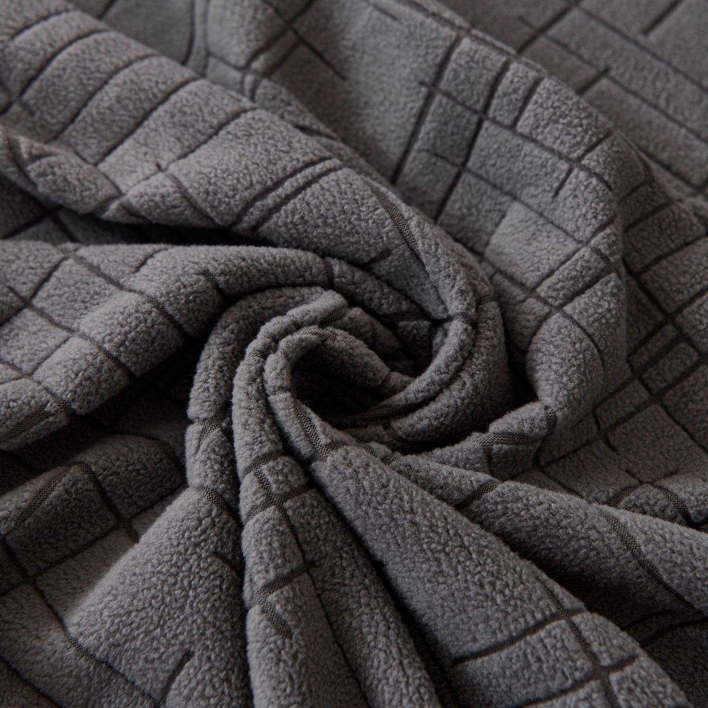 Close-up of Embossed Lines Couch Covers Stretchable Non-Slip & Washable Sofa Slipcovers in gray color.