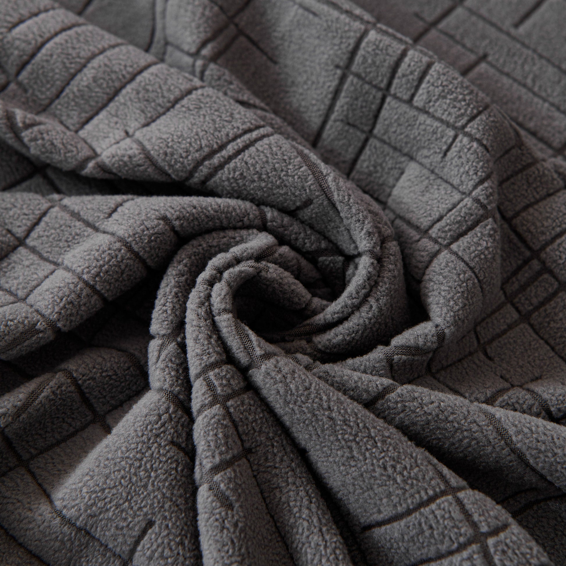 Close-up of Embossed Lines Couch Covers Stretchable Non-Slip & Washable Sofa Slipcovers in gray color.