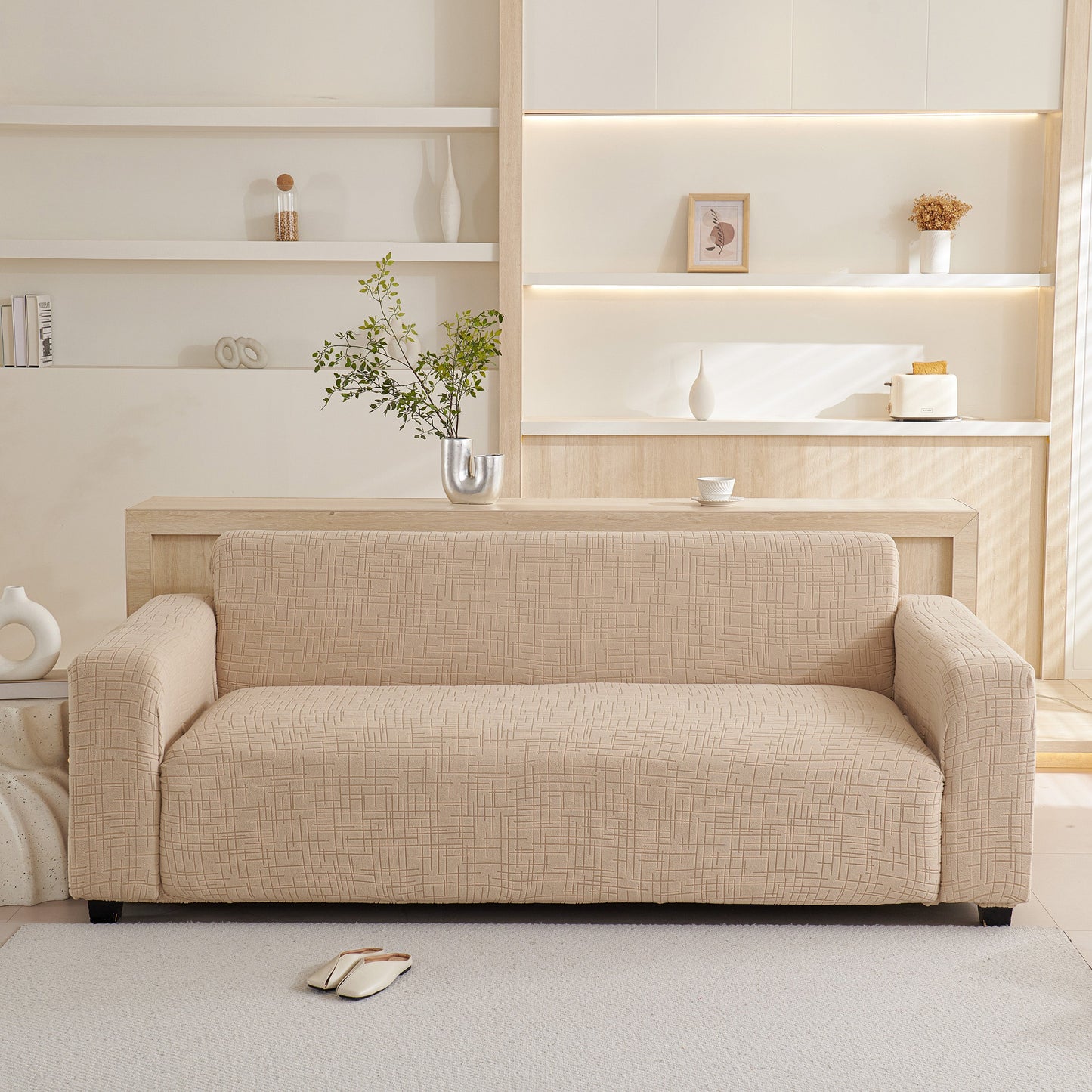 Embossed Lines Couch Covers Stretchable Non-Slip & Washable Sofa Slipcovers on beige sofa in modern living room setting.