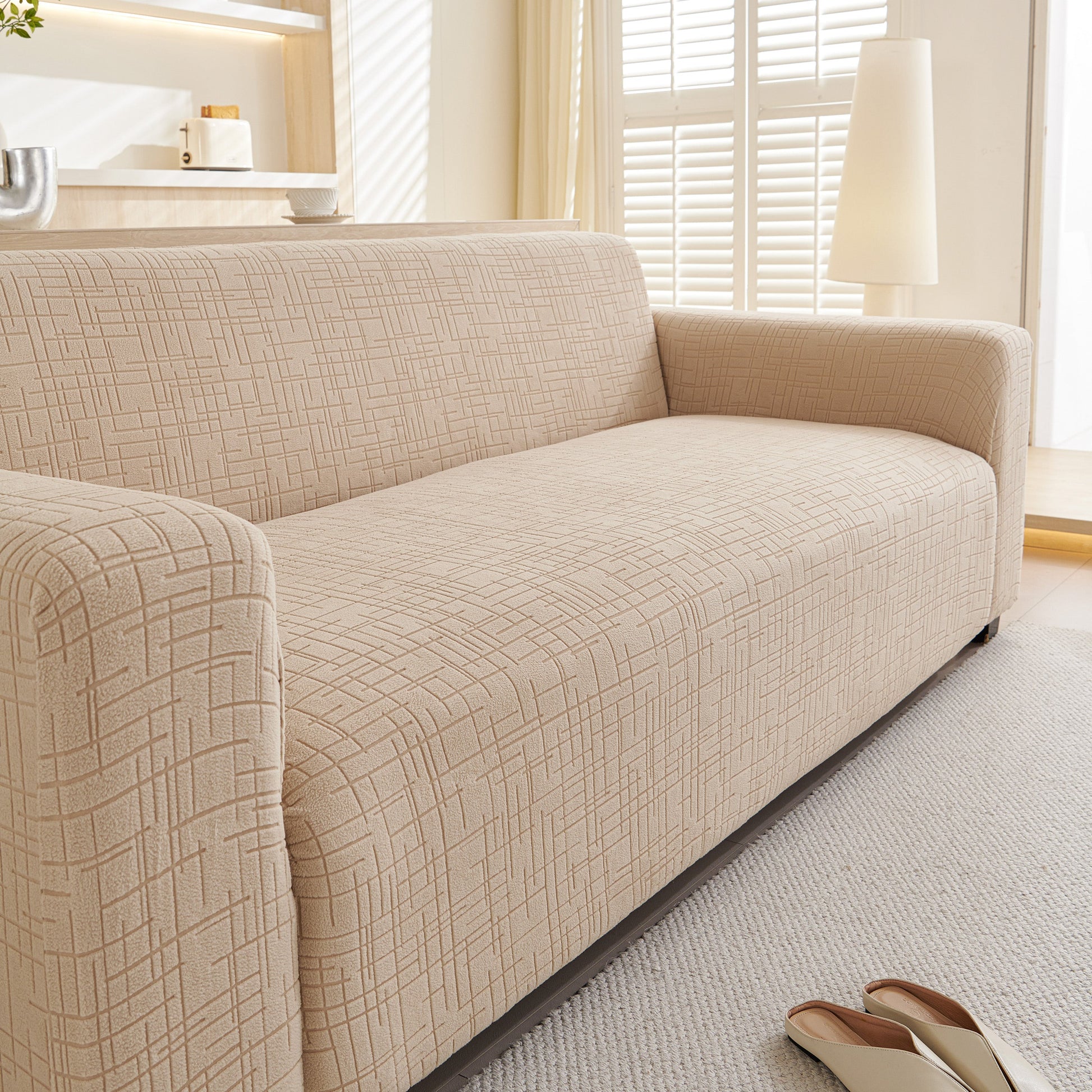 Embossed Lines Couch Covers Stretchable Non-Slip & Washable Sofa Slipcovers providing protection and style in a modern living room