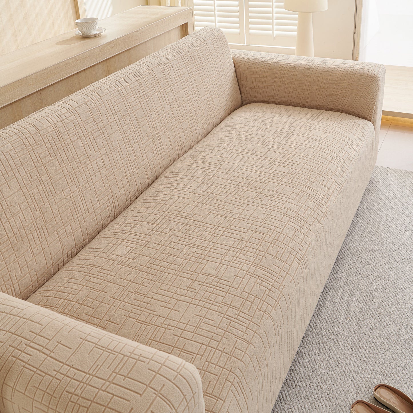 Embossed Lines Couch Covers Stretchable Non-Slip & Washable Sofa Slipcovers in beige with textured design, perfect for modern living rooms.