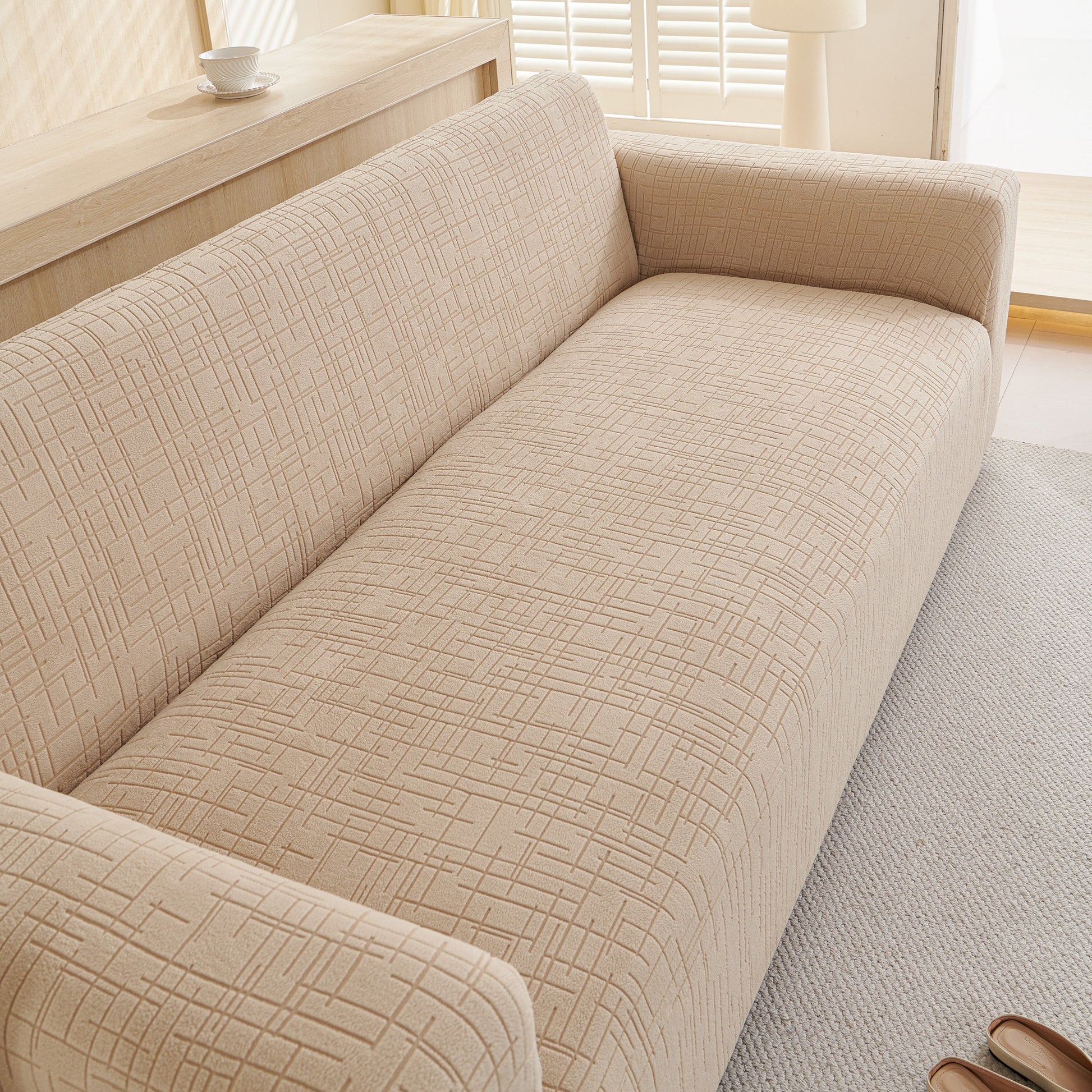 Embossed Lines Couch Covers Stretchable Non-Slip & Washable Sofa Slipcovers in beige with textured design, perfect for modern living rooms.