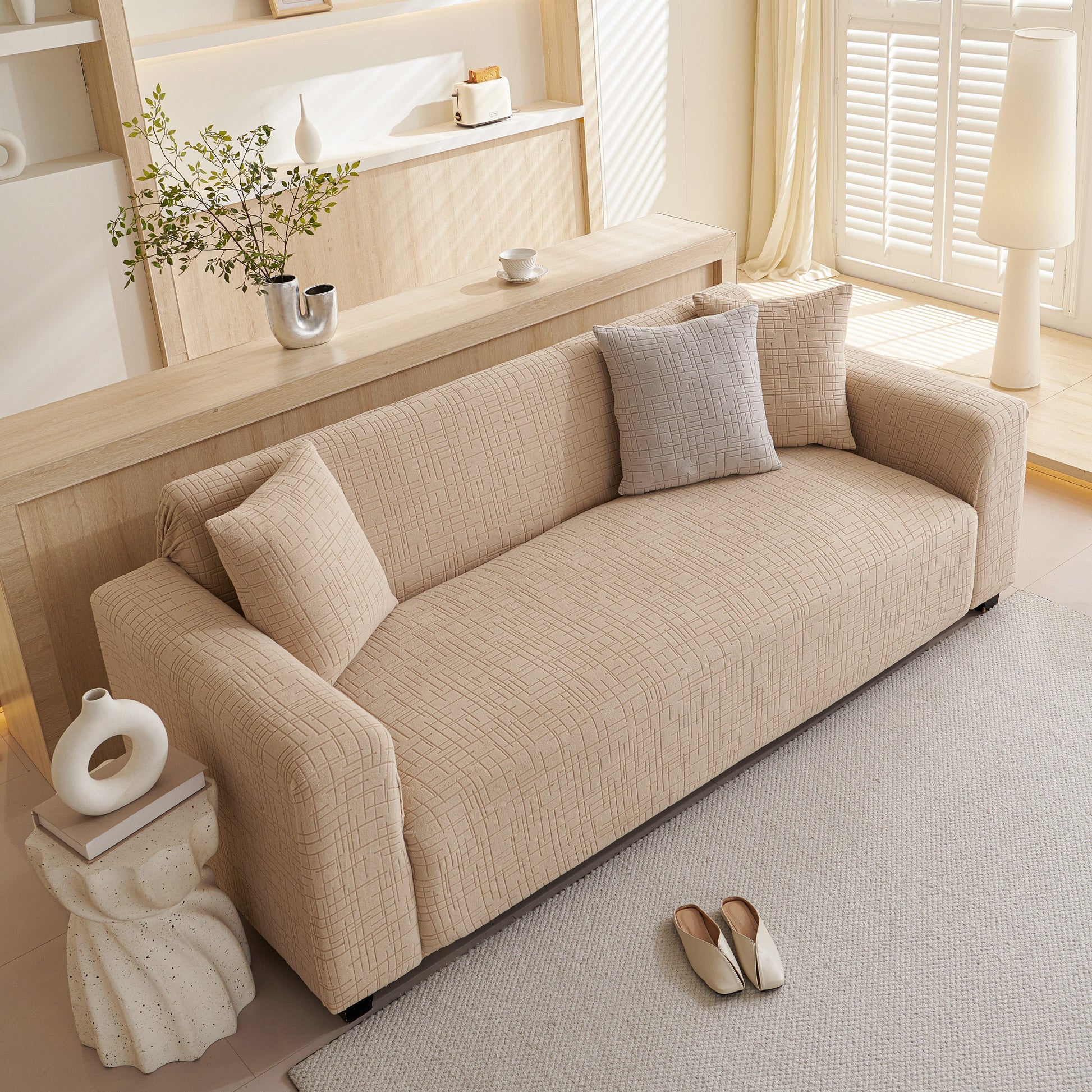 Living room with sofa covered by Embossed Lines Couch Covers Stretchable Non-Slip & Washable Sofa Slipcovers