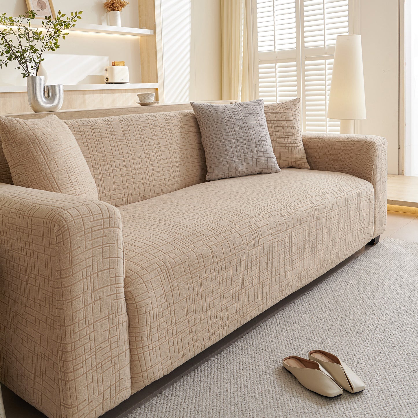 Embossed Lines Couch Covers Stretchable Non-Slip & Washable Sofa Slipcovers on beige couch in living room
