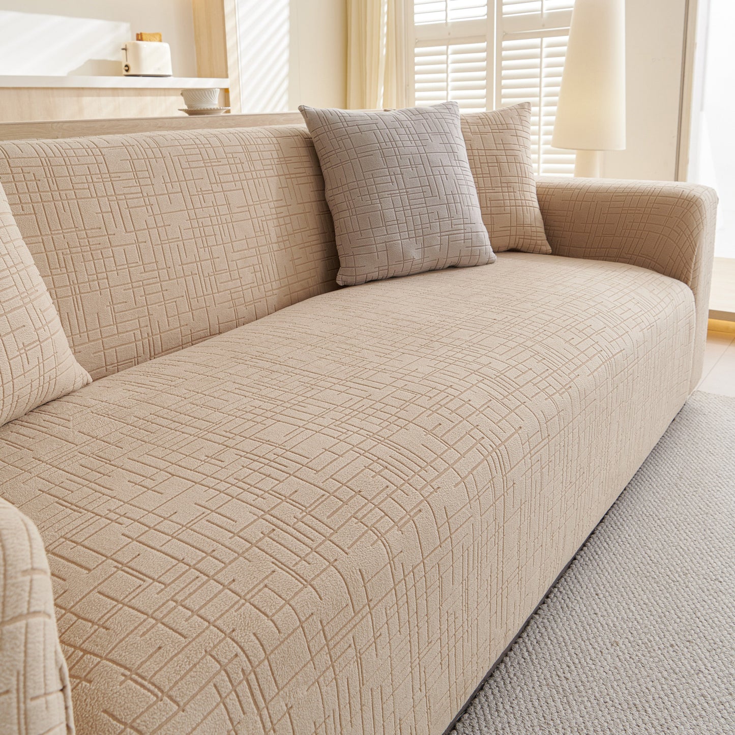 Embossed Lines Couch Covers Stretchable Non-Slip & Washable Sofa Slipcovers on beige sofa with grey pillow