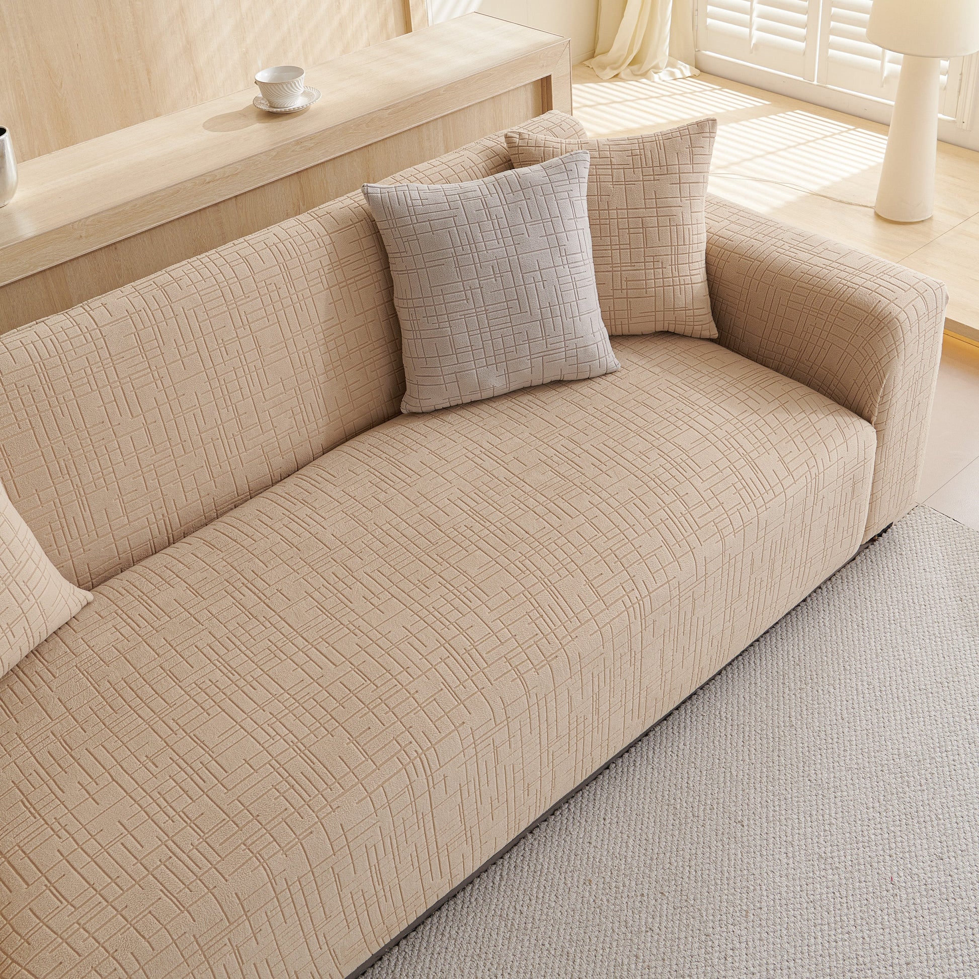 Embossed Lines Couch Covers Stretchable Non-Slip & Washable Sofa Slipcovers on beige sofa with cushions
