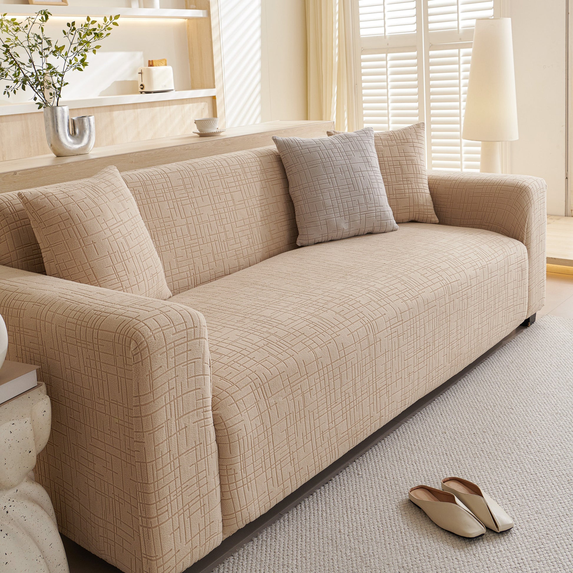 Embossed Lines Couch Covers Stretchable Non-Slip & Washable Sofa Slipcovers enhancing a modern living room decor.