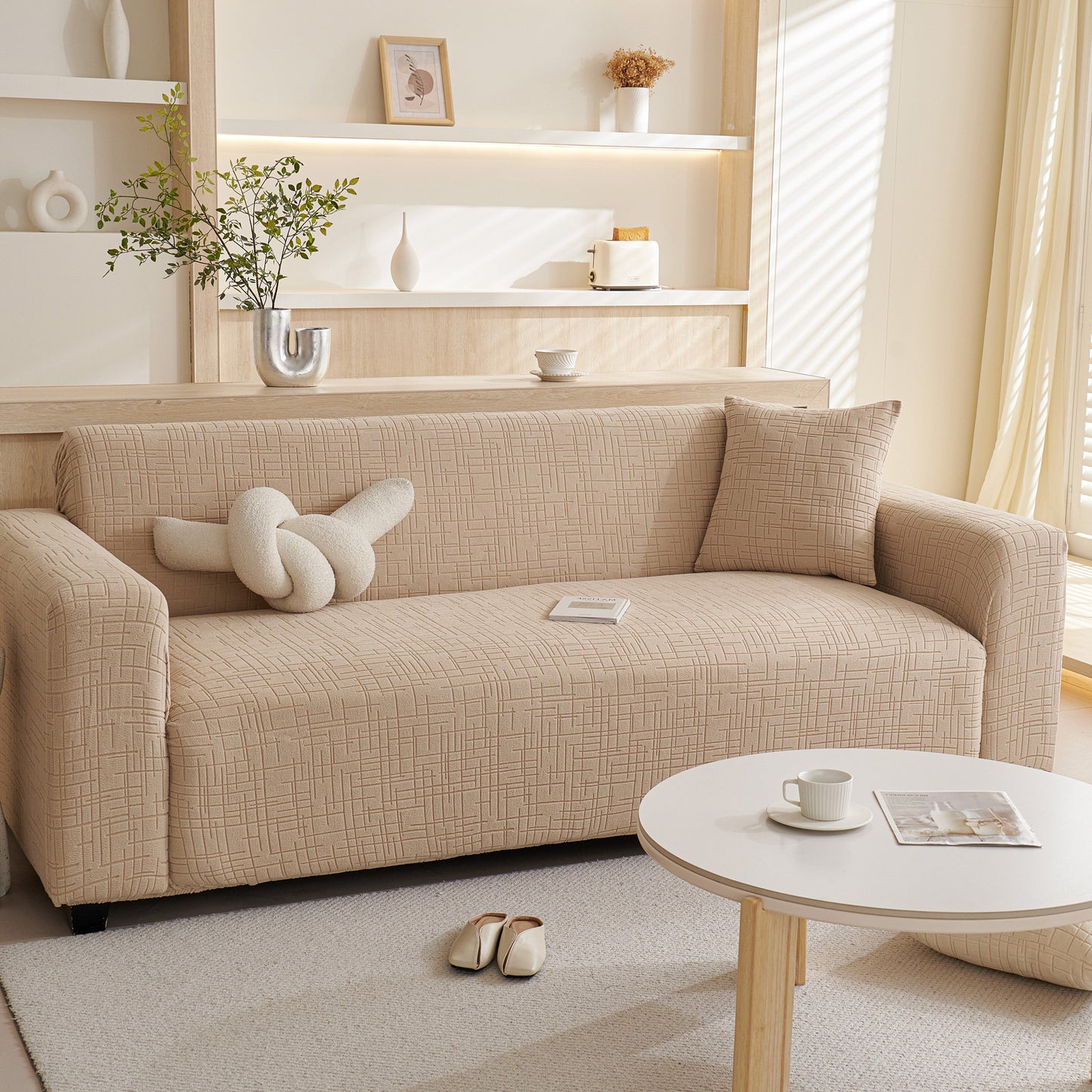 Embossed Lines Couch Covers Stretchable Non-Slip & Washable Sofa Slipcovers on a beige sofa in a modern living room setting.