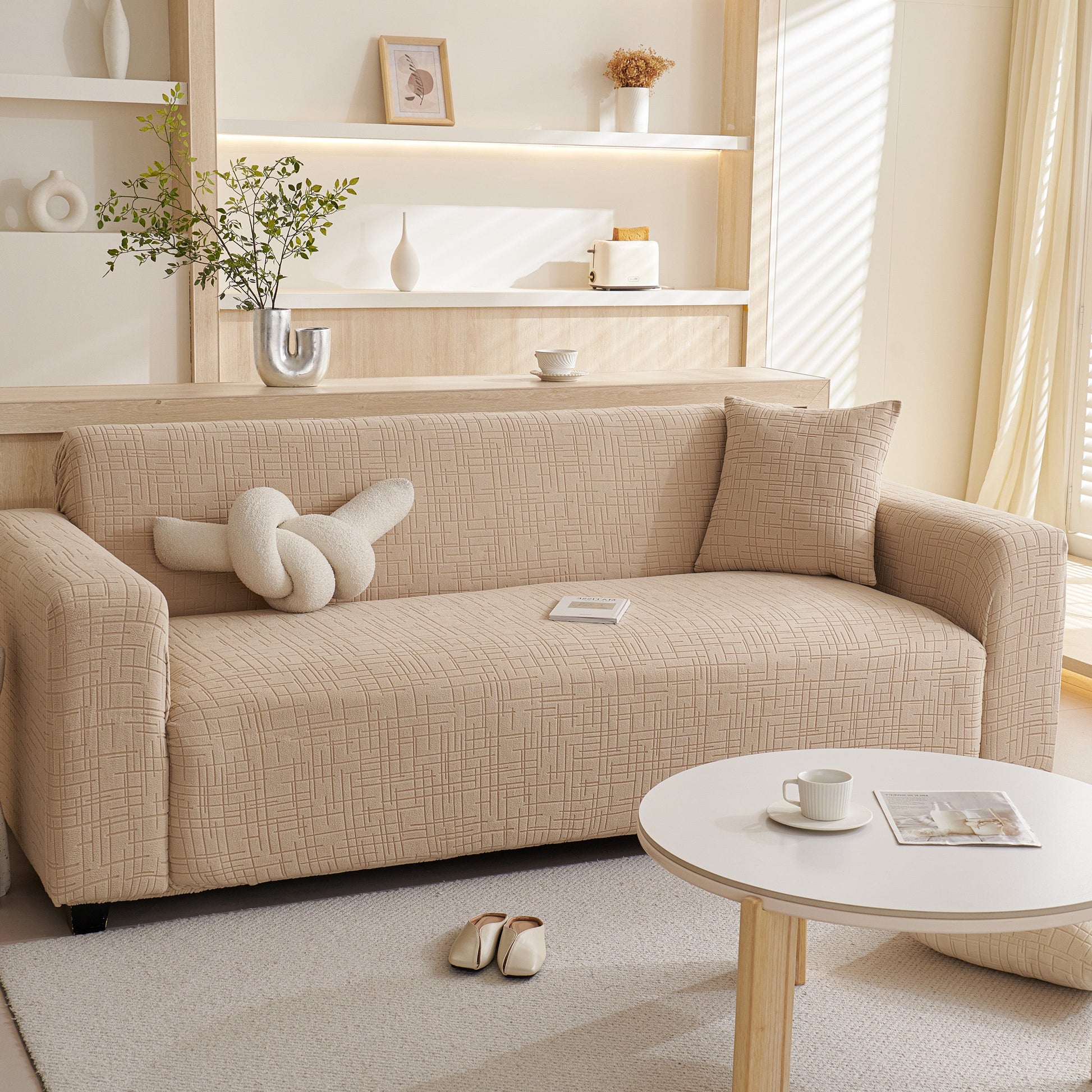 Embossed Lines Couch Covers Stretchable Non-Slip & Washable Sofa Slipcovers on a beige sofa in a modern living room setting.