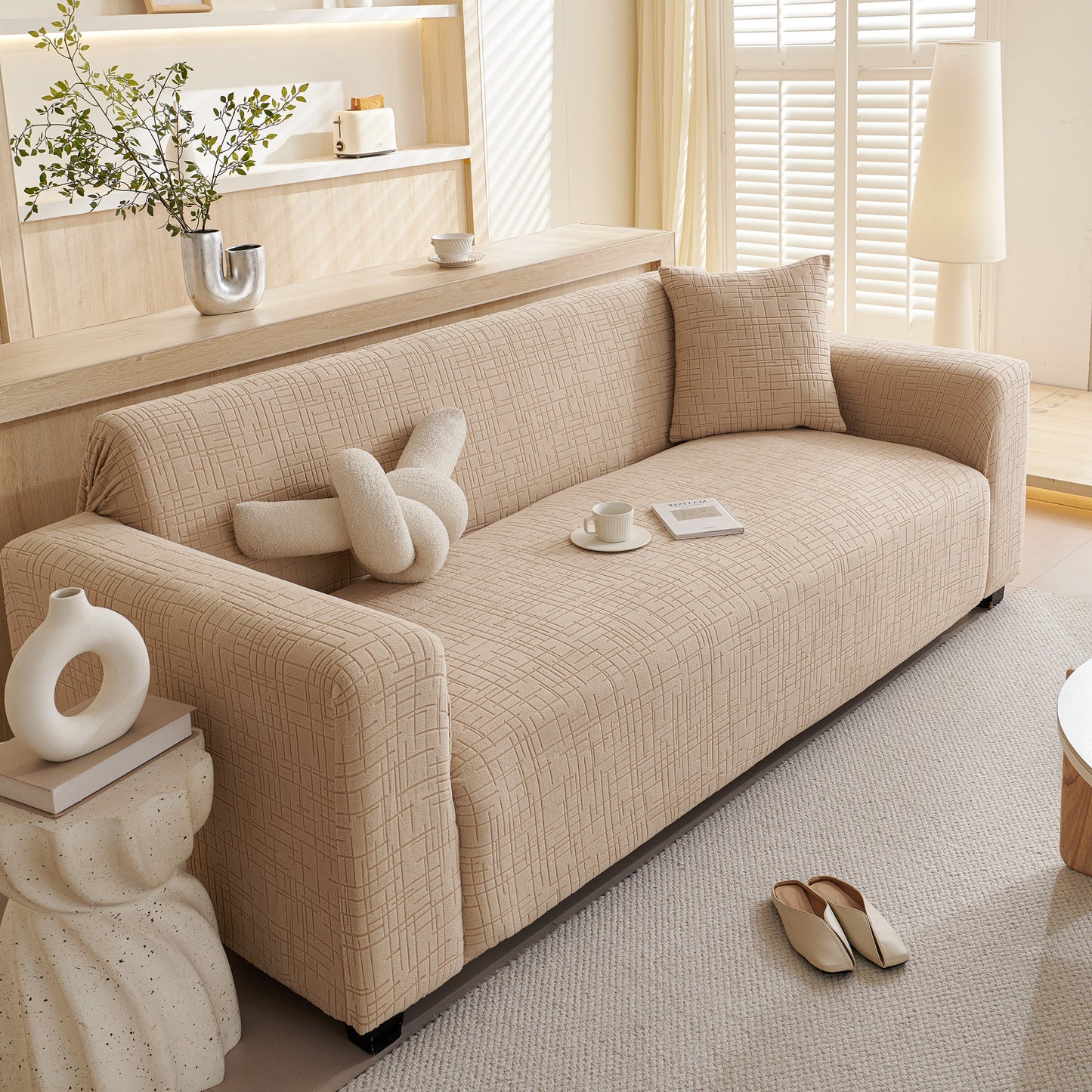 Embossed Lines Couch Covers Stretchable Non-Slip & Washable Sofa Slipcovers on a beige sofa in a modern living room.