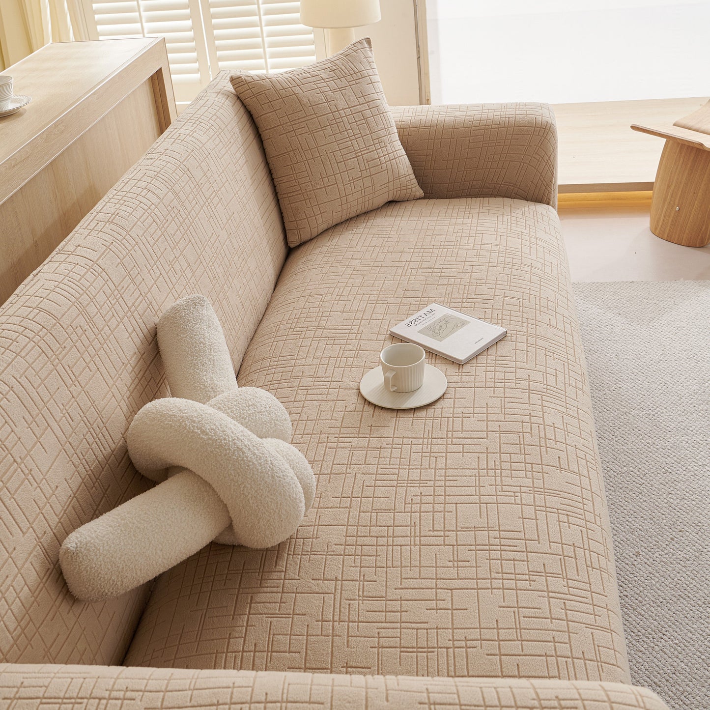 Embossed Lines Couch Covers Stretchable Non-Slip & Washable Sofa Slipcovers on stylish beige sofa with pillows and decorations
