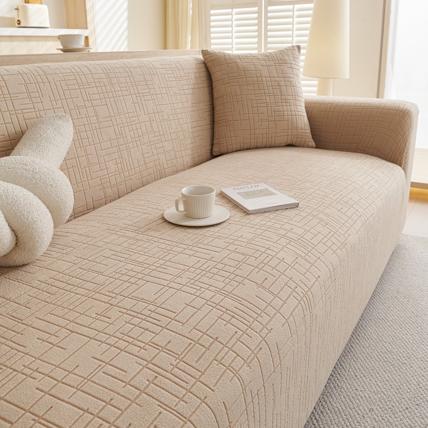 Embossed Lines Couch Covers Stretchable Non-Slip & Washable Sofa Slipcovers on beige sofa in living room setting