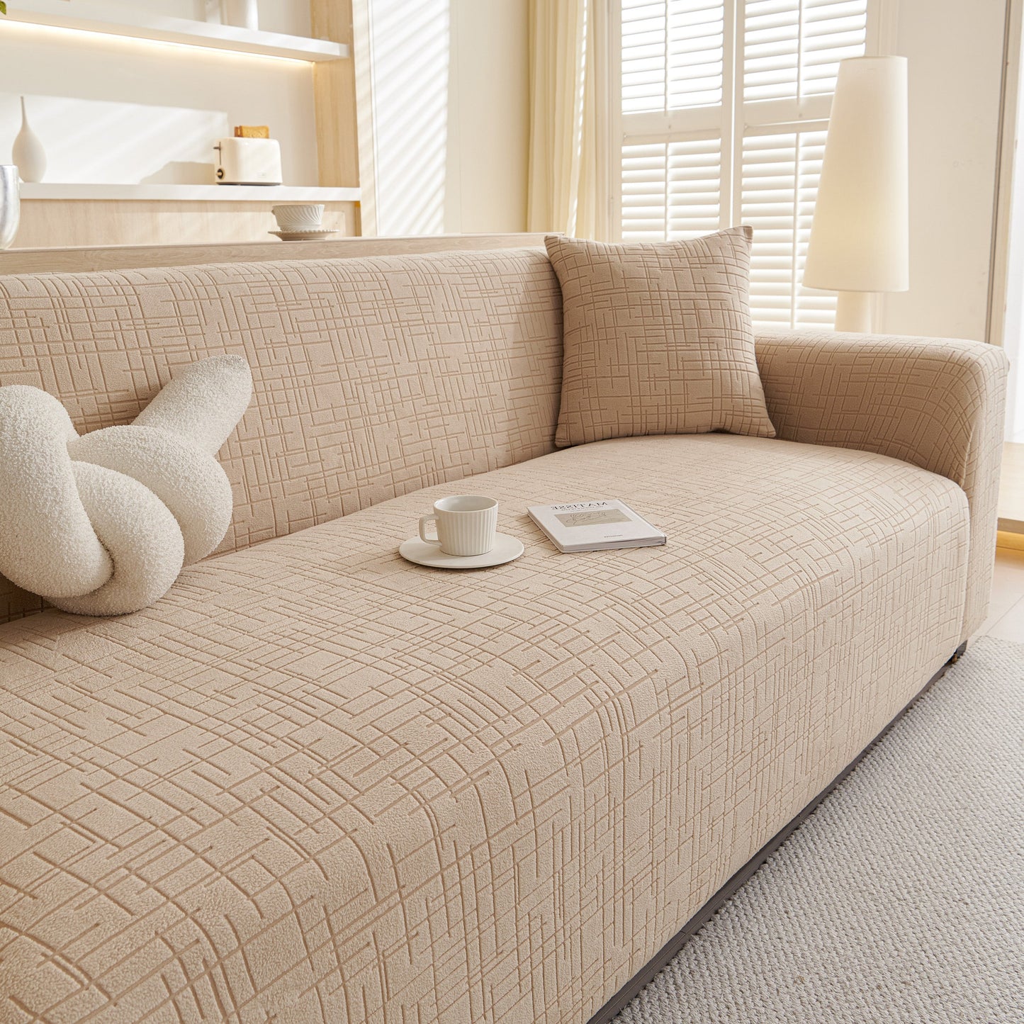 Embossed Lines Couch Covers Stretchable Non-Slip & Washable Sofa Slipcovers on a beige sofa in a bright living room