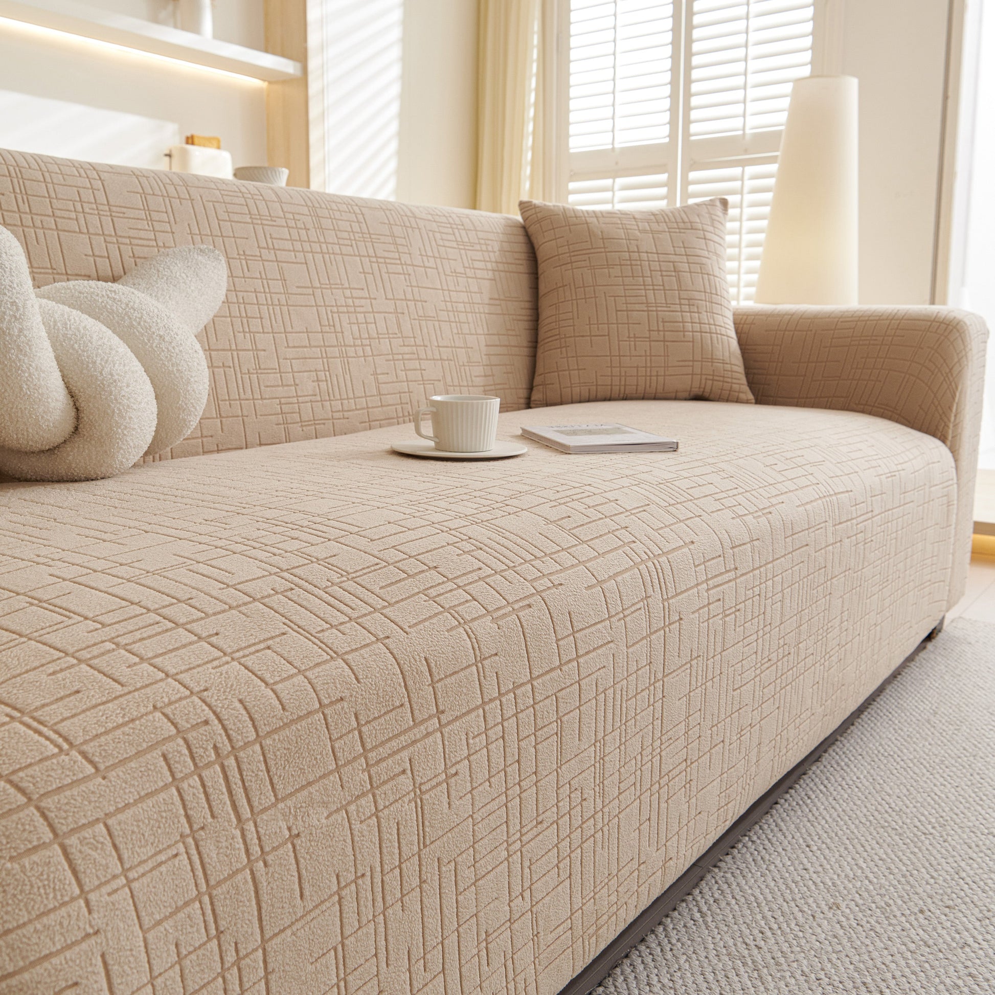 Embossed Lines Couch Covers Stretchable Non-Slip & Washable Sofa Slipcovers on beige couch in modern living room setting