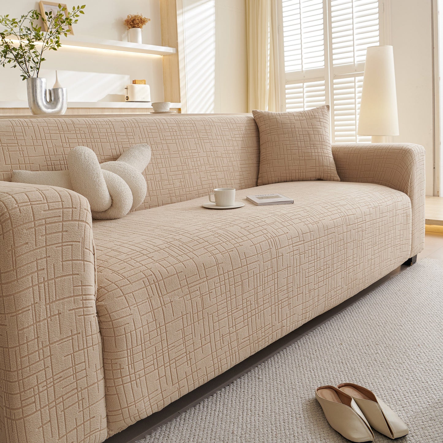 Embossed Lines Couch Covers Stretchable Non-Slip & Washable Sofa Slipcovers in modern living room setting with soft beige fabric.