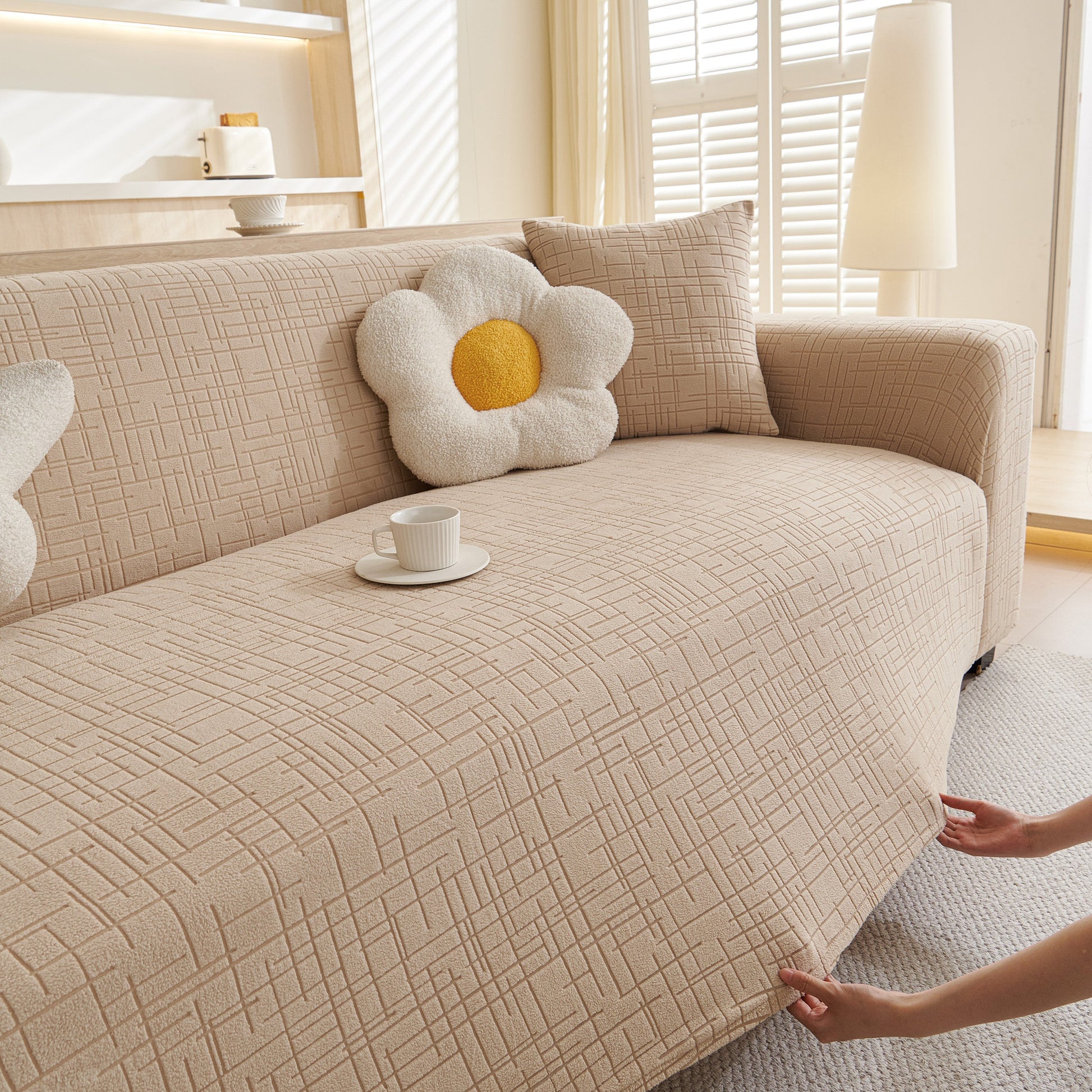 Embossed Lines Couch Covers Stretchable Non-Slip & Washable Sofa Slipcovers in a cozy living room setting with a floral pillow.