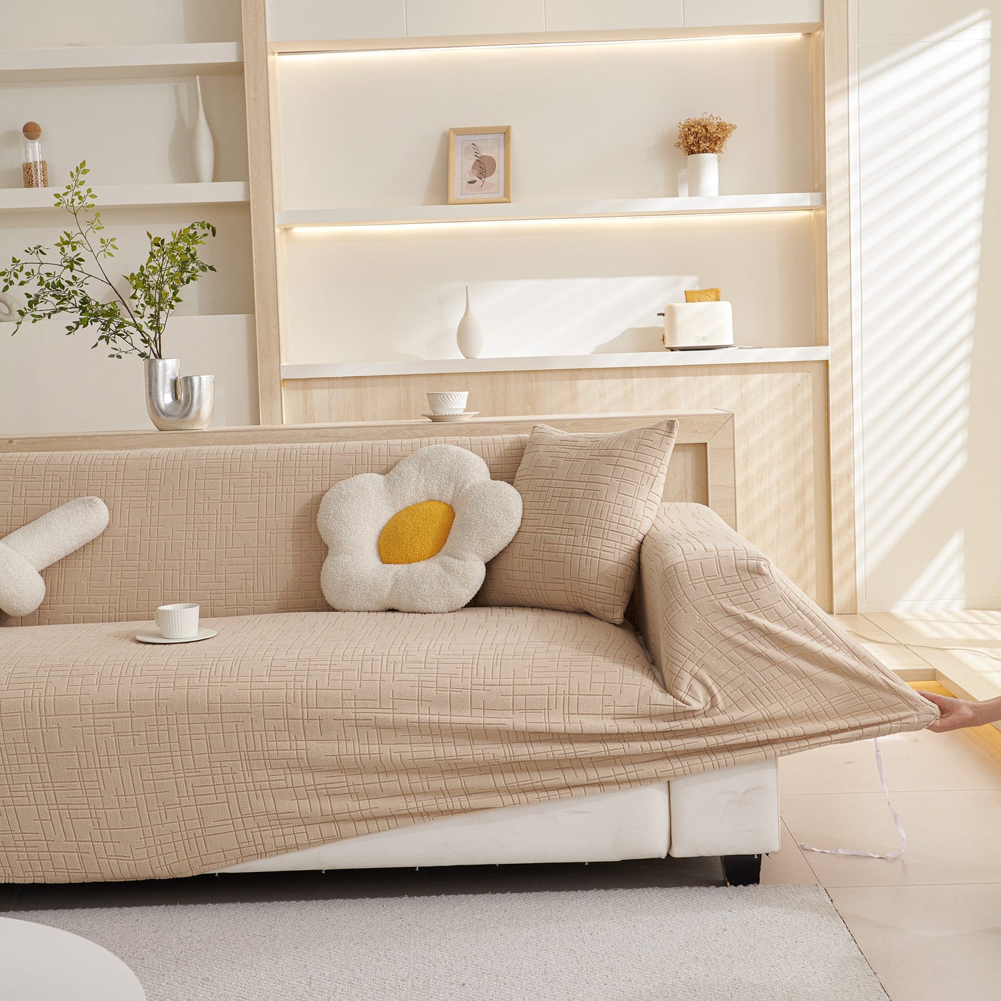 Living room with Embossed Lines Couch Covers Stretchable Non-Slip & Washable Sofa Slipcovers in beige on a modern sofa.