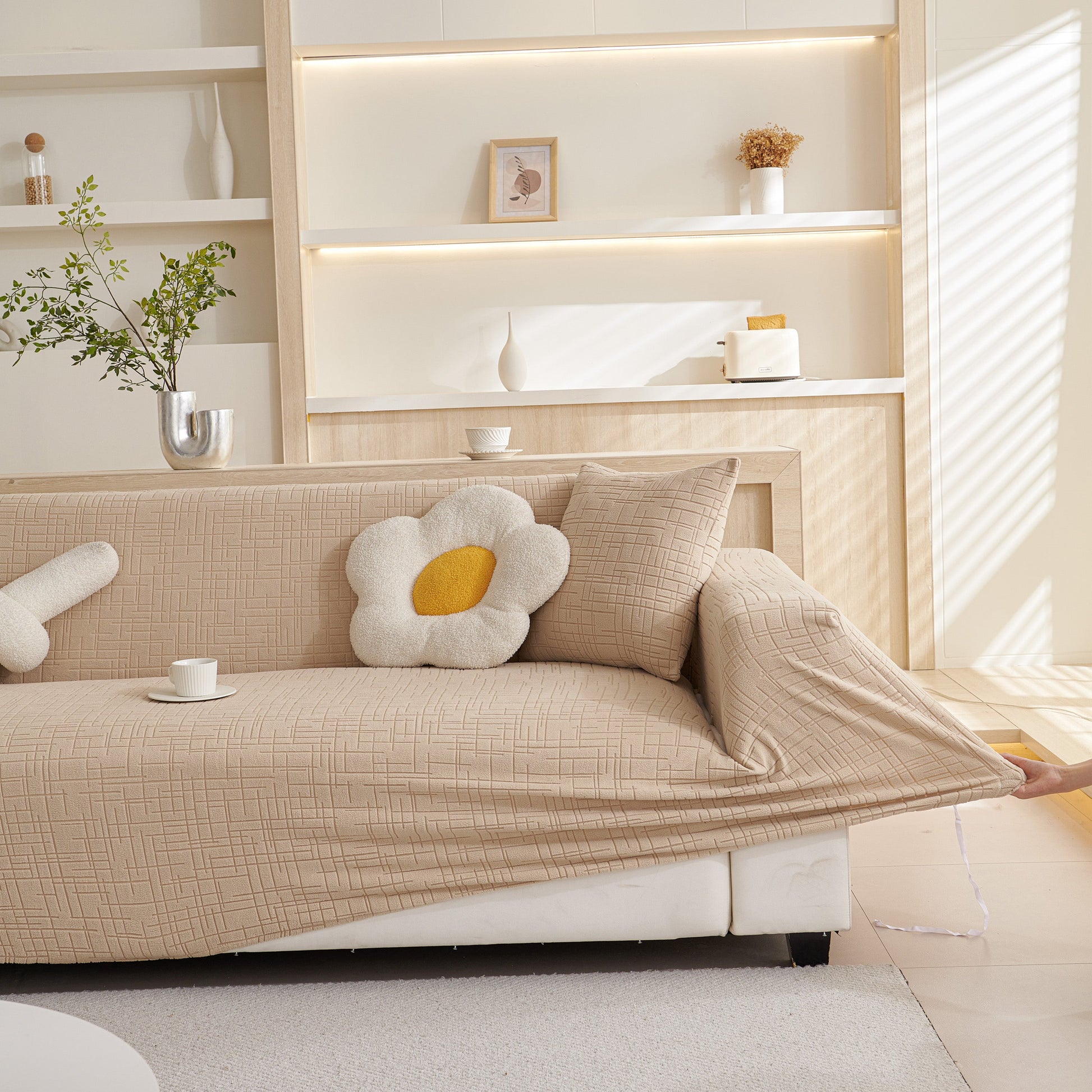 Living room with Embossed Lines Couch Covers Stretchable Non-Slip & Washable Sofa Slipcovers in beige on a modern sofa.