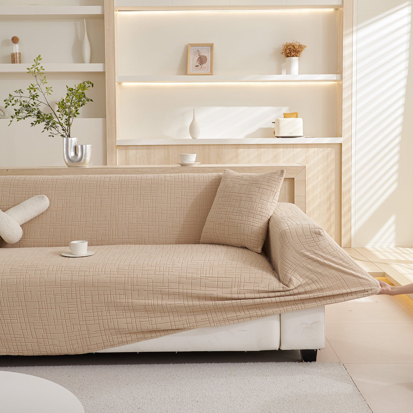 Embossed Lines Couch Covers Stretchable Non-Slip & Washable Sofa Slipcovers in beige on a modern living room sofa.