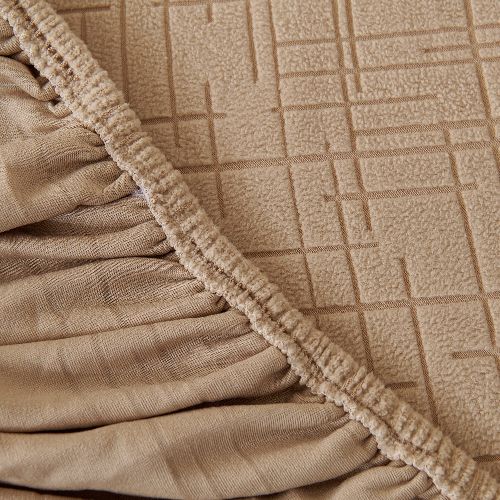 Embossed Lines Couch Covers Stretchable Non-Slip & Washable Sofa Slipcovers in tan color showing detailed fabric texture and elastic edge.