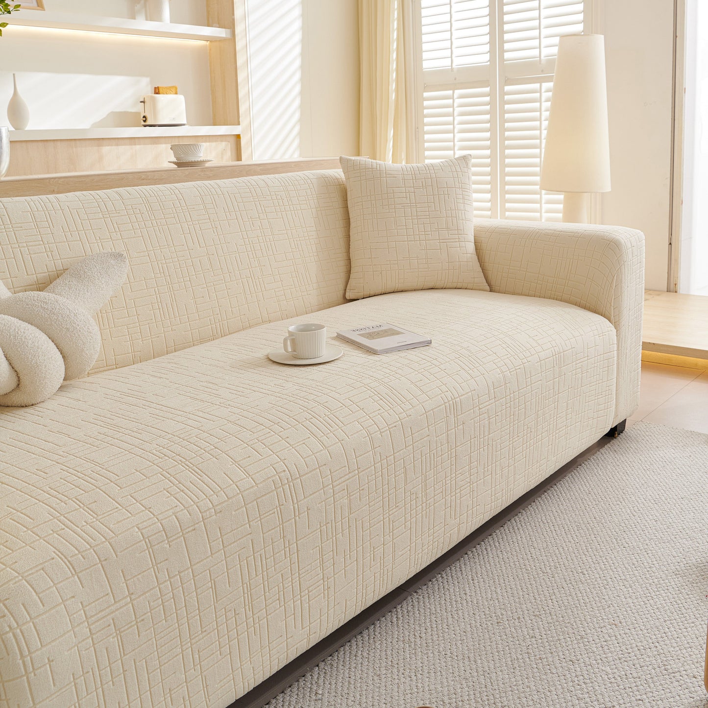 Embossed Lines Couch Covers Stretchable Non-Slip & Washable Sofa Slipcovers for comfortable and stylish protection on a sofa in a modern living room.