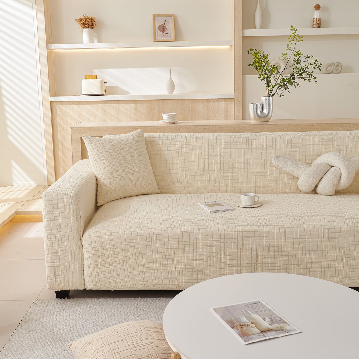 Embossed Lines Couch Covers Stretchable Non-Slip & Washable Sofa Slipcovers on a modern beige sofa in a cozy living room setting.