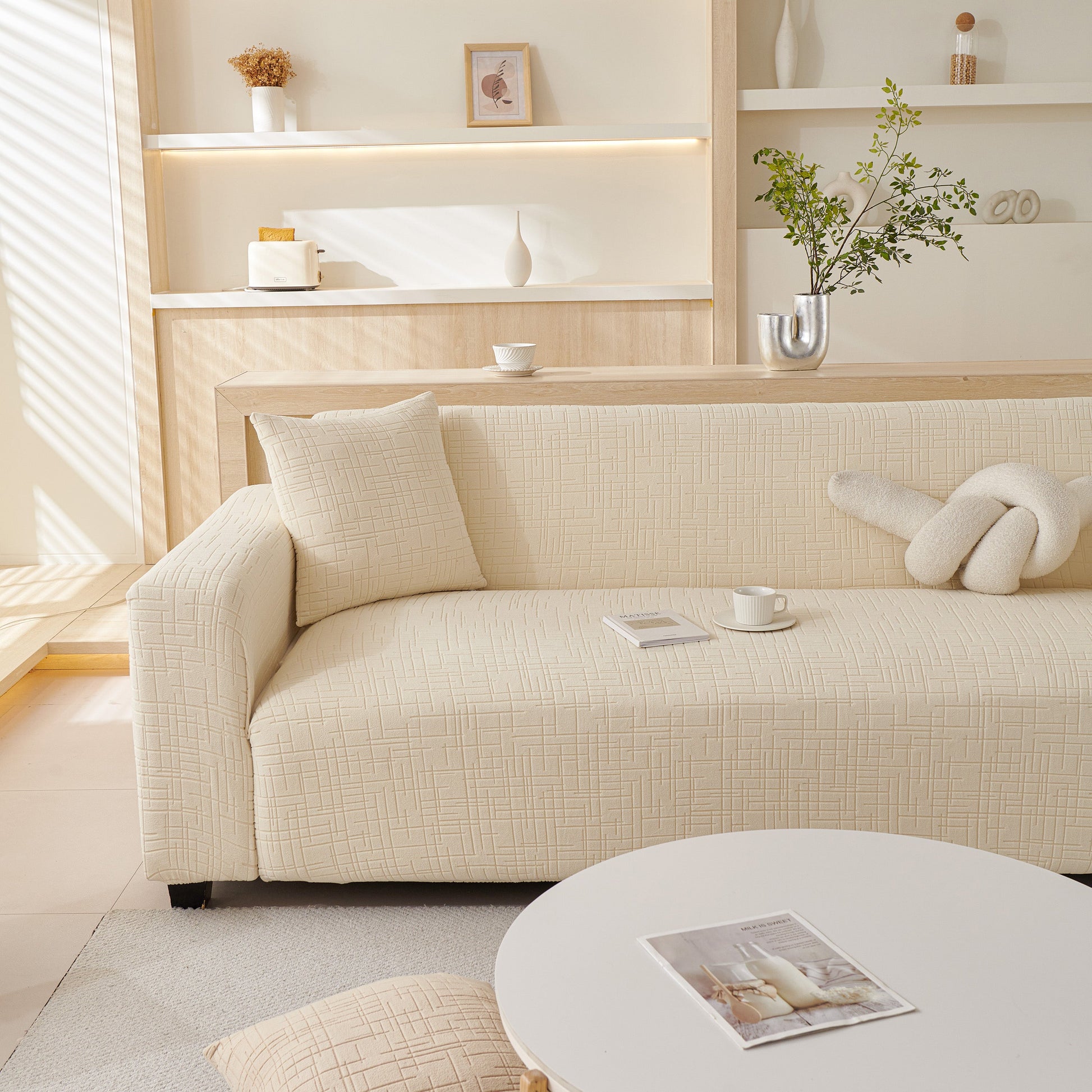 Embossed Lines Couch Covers Stretchable Non-Slip & Washable Sofa Slipcovers on a modern beige sofa in a cozy living room setting.