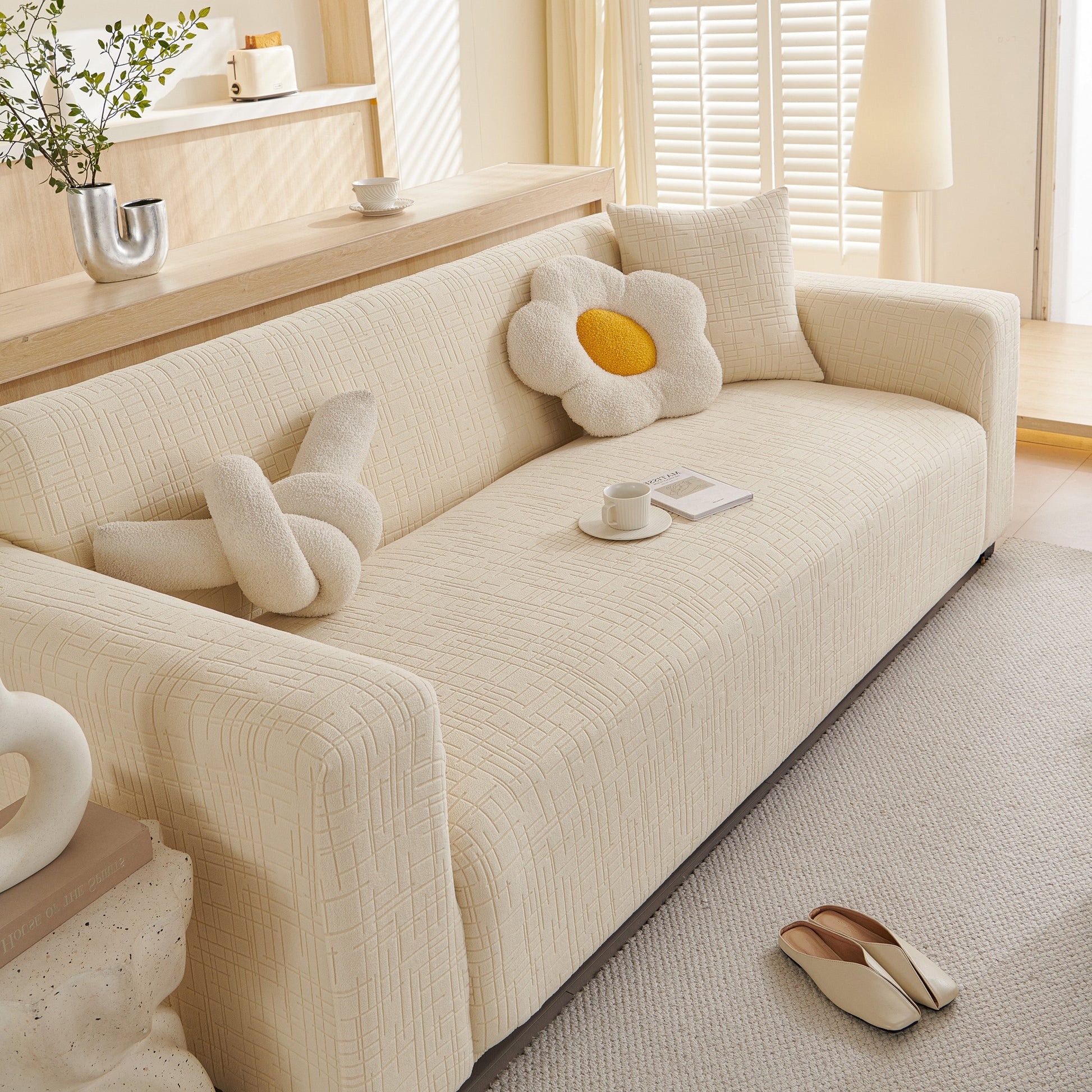 Embossed Lines Couch Covers Stretchable Non-Slip & Washable Sofa Slipcovers on a modern beige couch