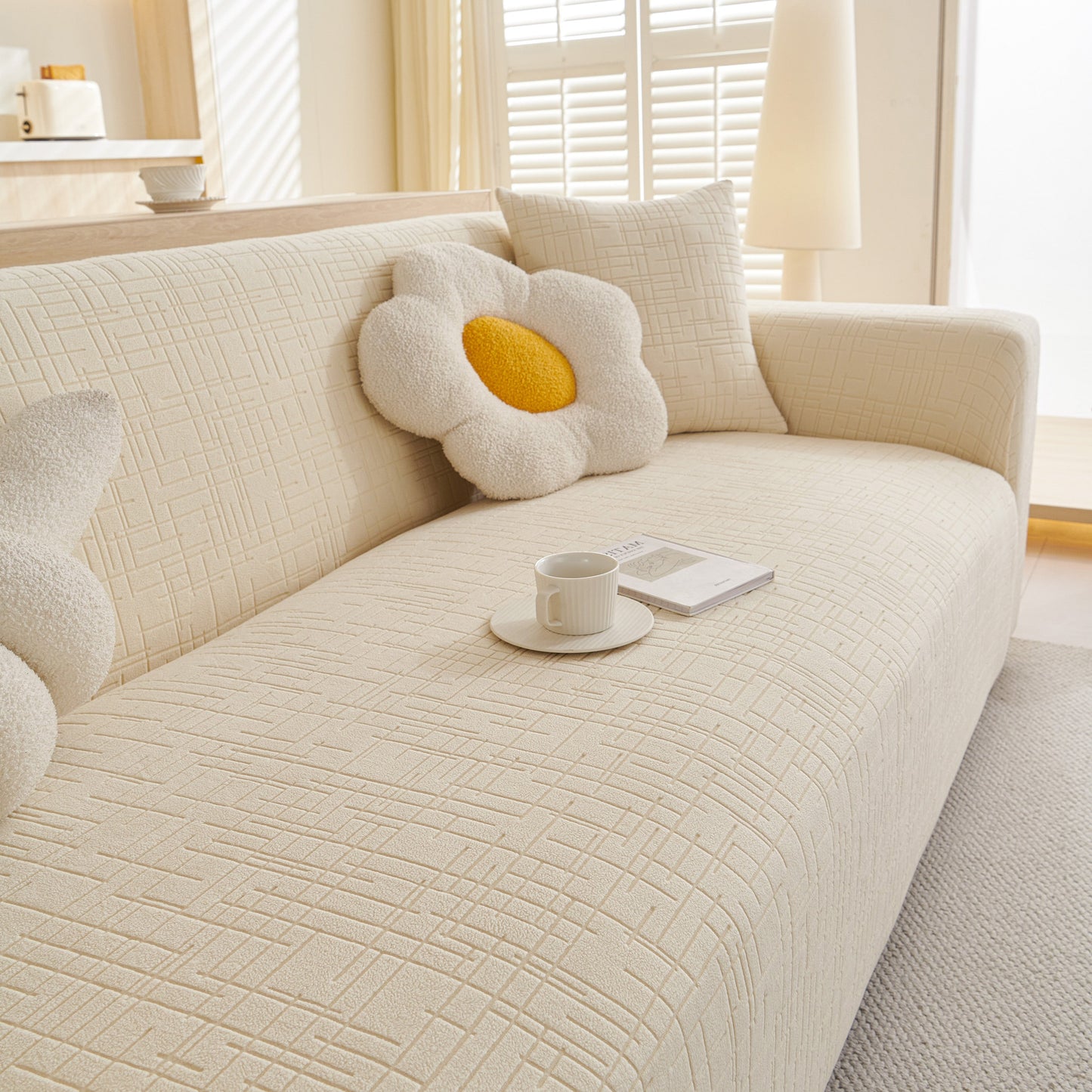 Comfortable Embossed Lines Couch Covers Stretchable Non-Slip & Washable Sofa Slipcovers on a beige sofa with decorative pillows.